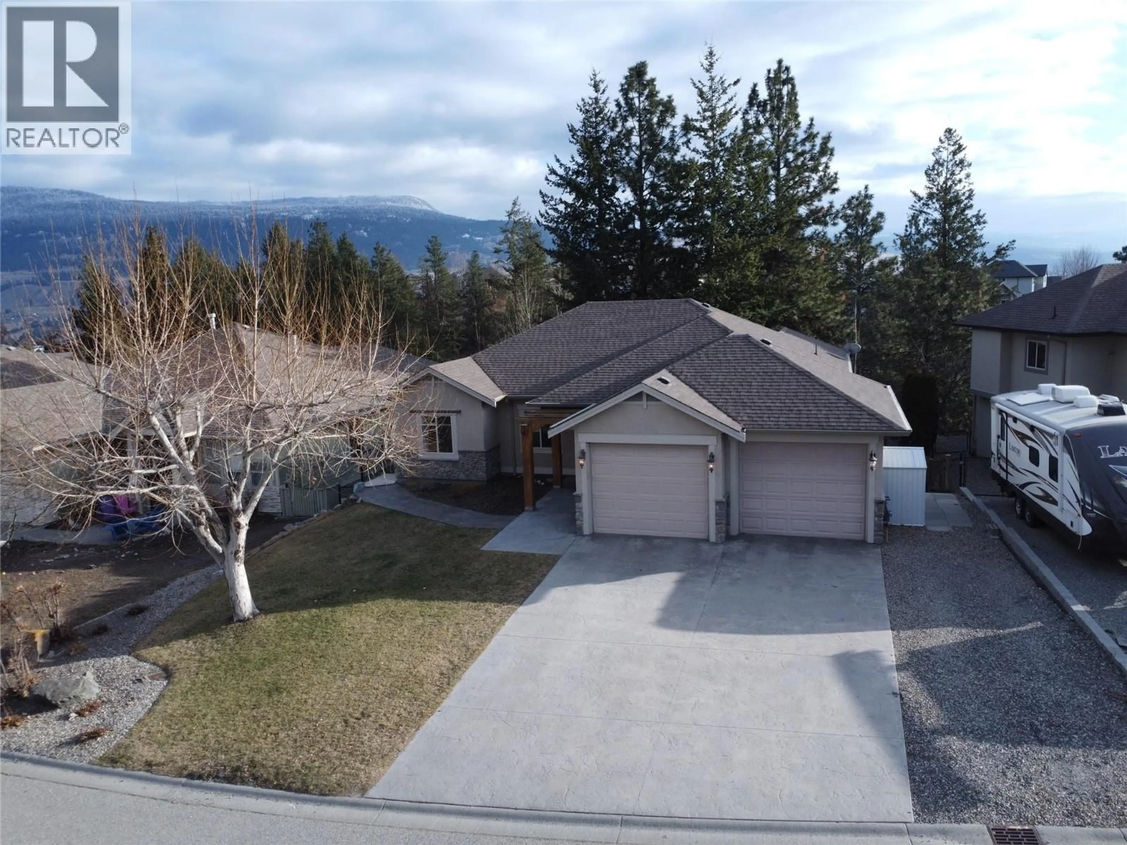 A pic from outside/outdoor area/front of a property/back of a property/a pic from drone, mountain view for 12633 DRIFTWOOD COURT, Lake Country British Columbia V4V2M9
