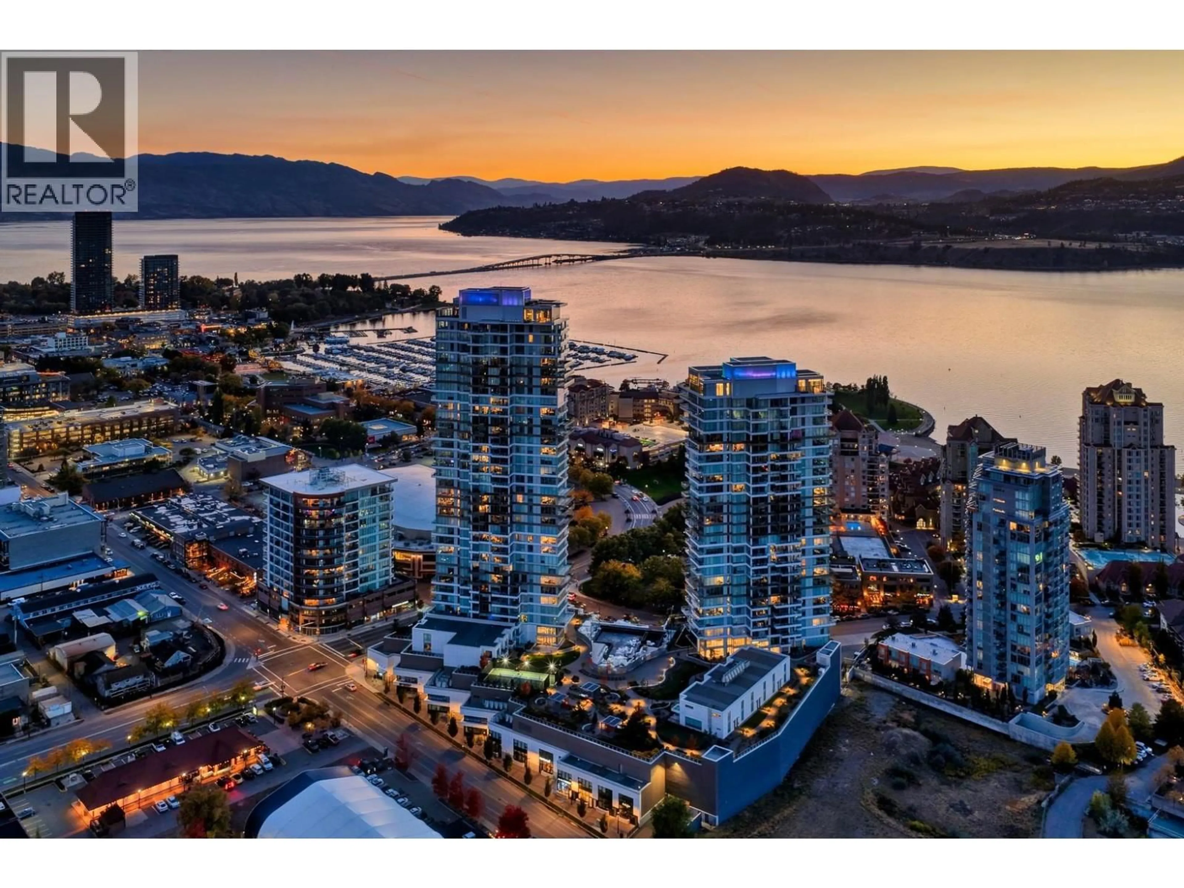 A pic from outside/outdoor area/front of a property/back of a property/a pic from drone, water/lake/river/ocean view for 2703 - 1181 SUNSET DRIVE, Kelowna British Columbia V1Y0J5