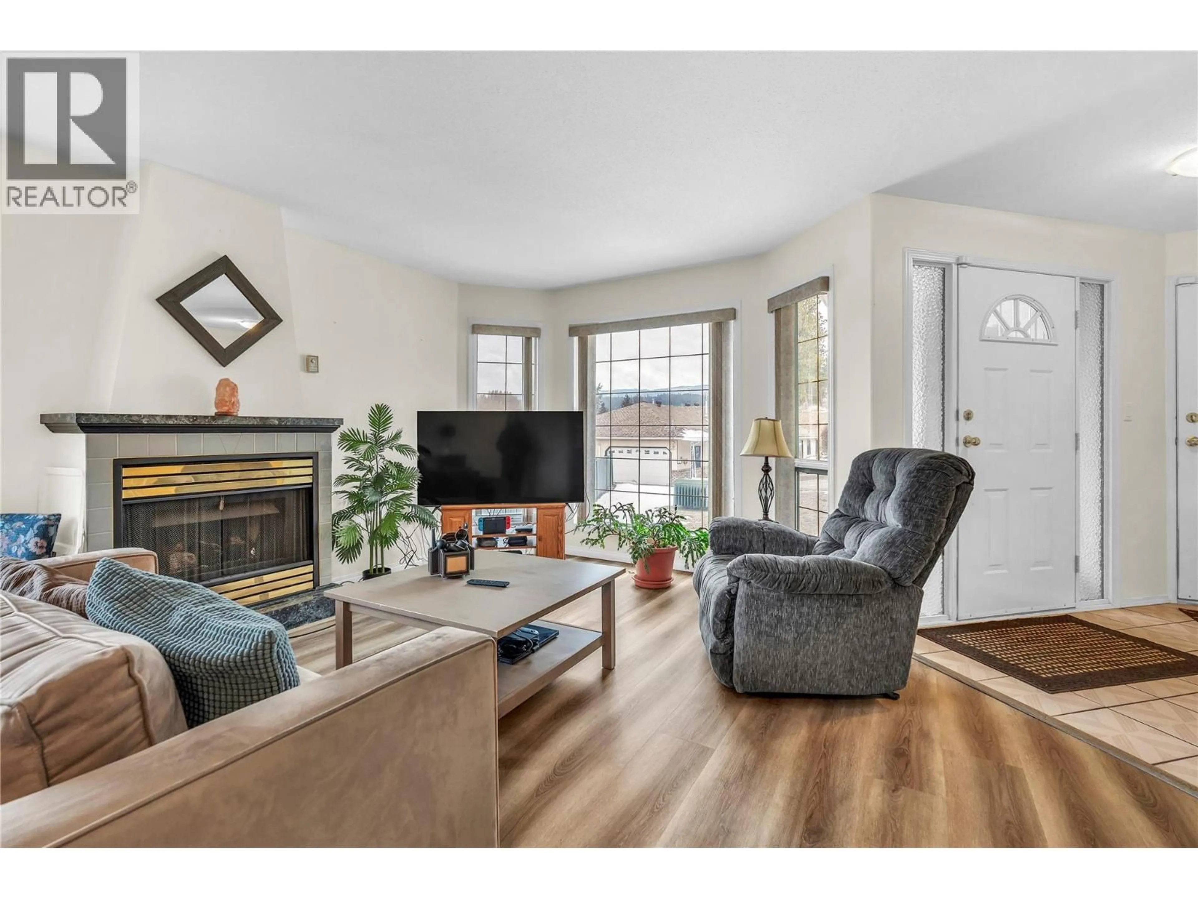 Living room with furniture, wood/laminate floor for A - 103 BRANDLMAYR GATE OTHER, Princeton British Columbia V0X1W0