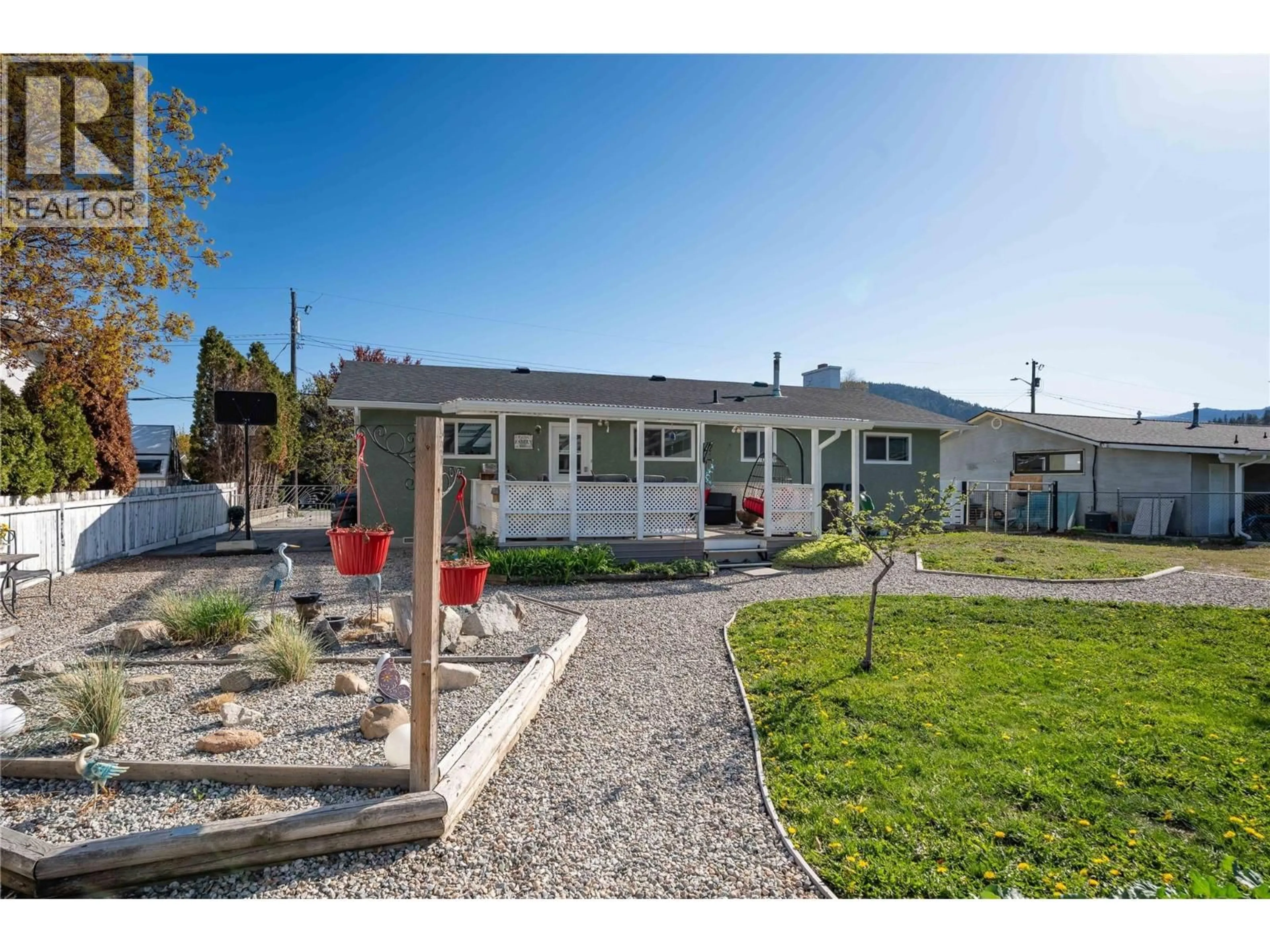 Home with vinyl exterior material, street for 12240 SAUNDERS CRESCENT, Summerland British Columbia V0H1Z0