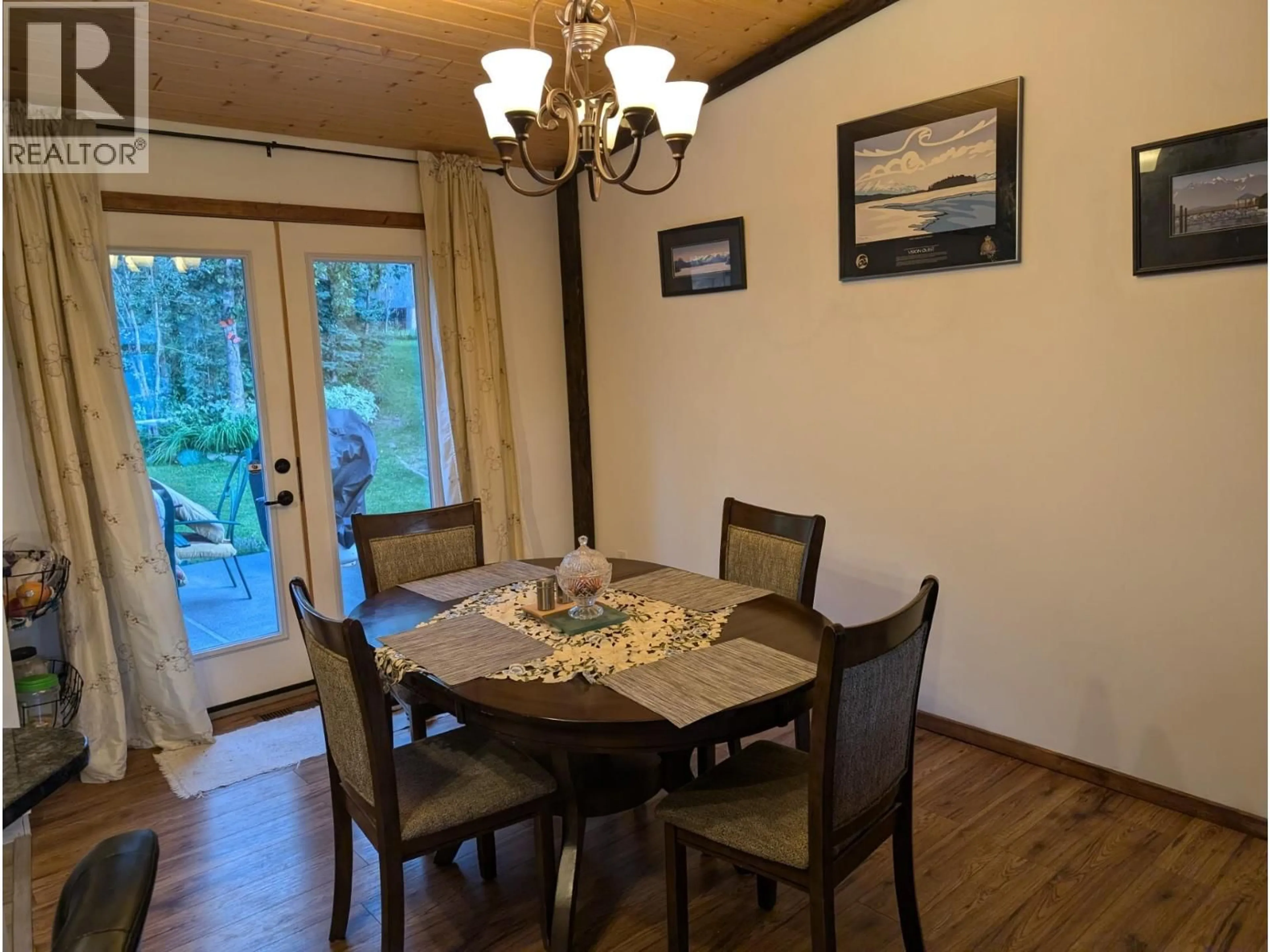 Dining room, wood/laminate floor for 56 SUKUNKA PLACE, Tumbler Ridge British Columbia V0C2W0
