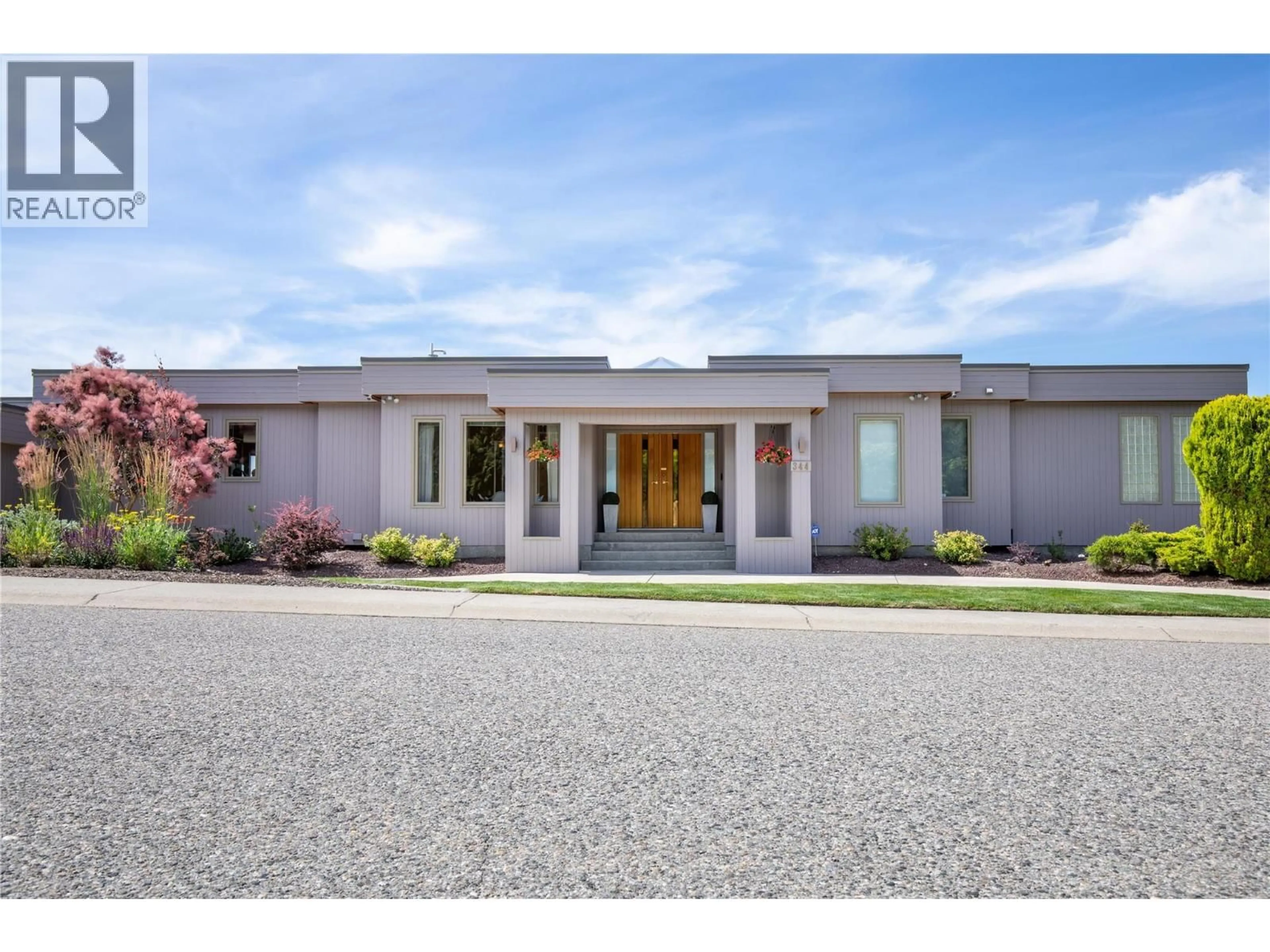 Home with brick exterior material, street for 344 RAVEN DRIVE, Kelowna British Columbia V1W3Y9