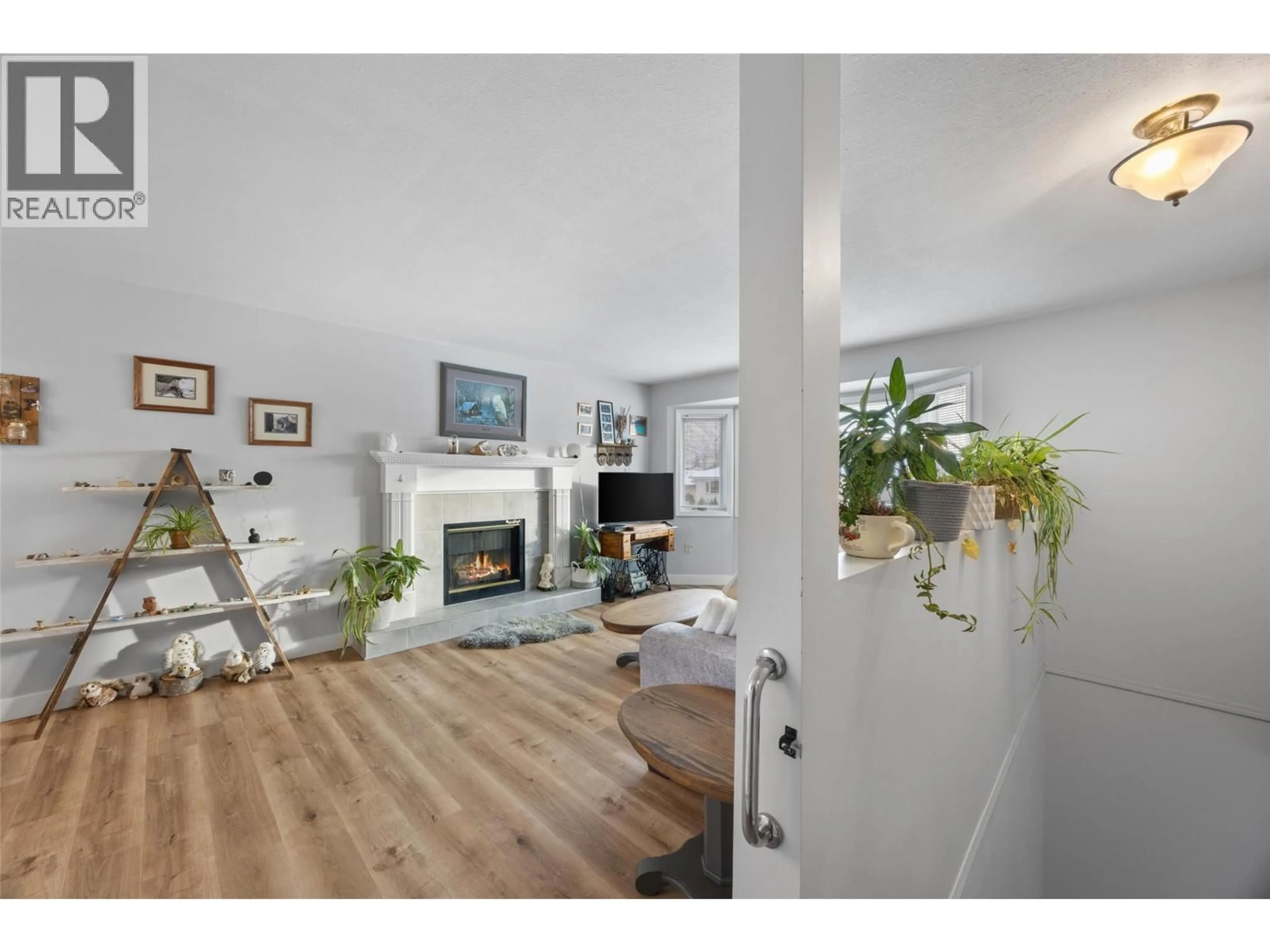 Living room with furniture, wood/laminate floor for 760 BISSETTE ROAD, Kamloops British Columbia V2B8H7