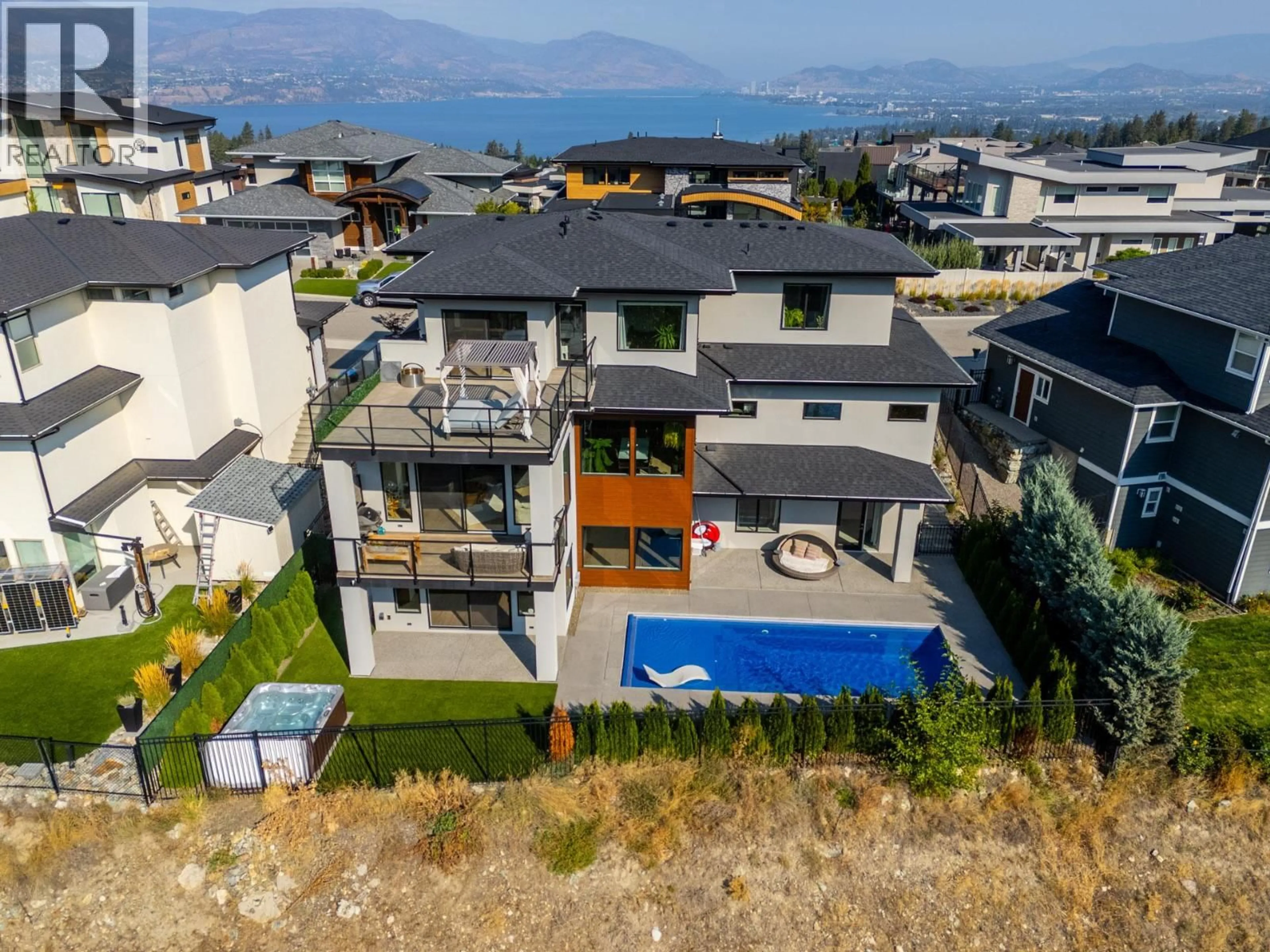 A pic from outside/outdoor area/front of a property/back of a property/a pic from drone, mountain view for 465 SWAN DRIVE, Kelowna British Columbia V1W5L9