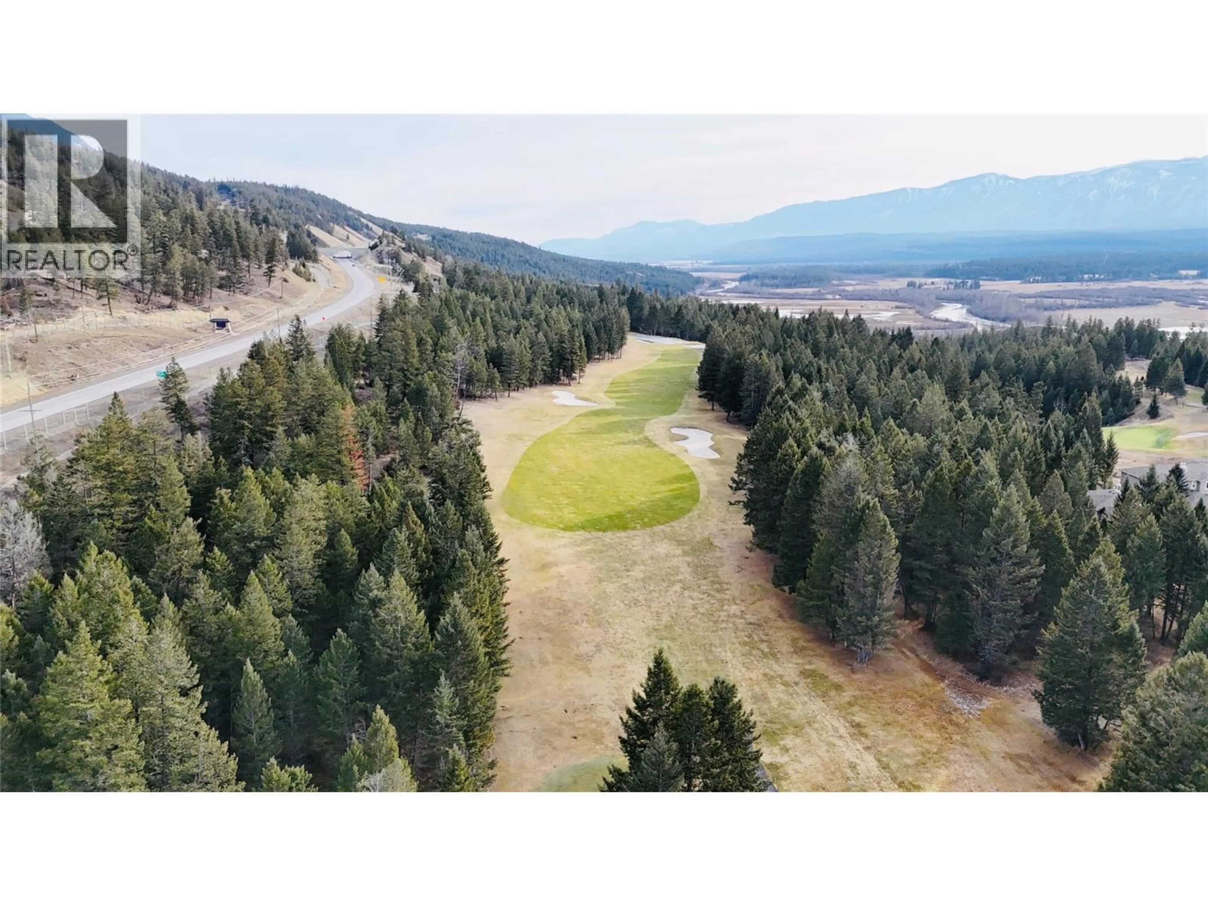 A pic from outside/outdoor area/front of a property/back of a property/a pic from drone, forest/trees view for 109 - 7599 EAGLECREST LANE, Radium Hot Springs British Columbia V0A1M0