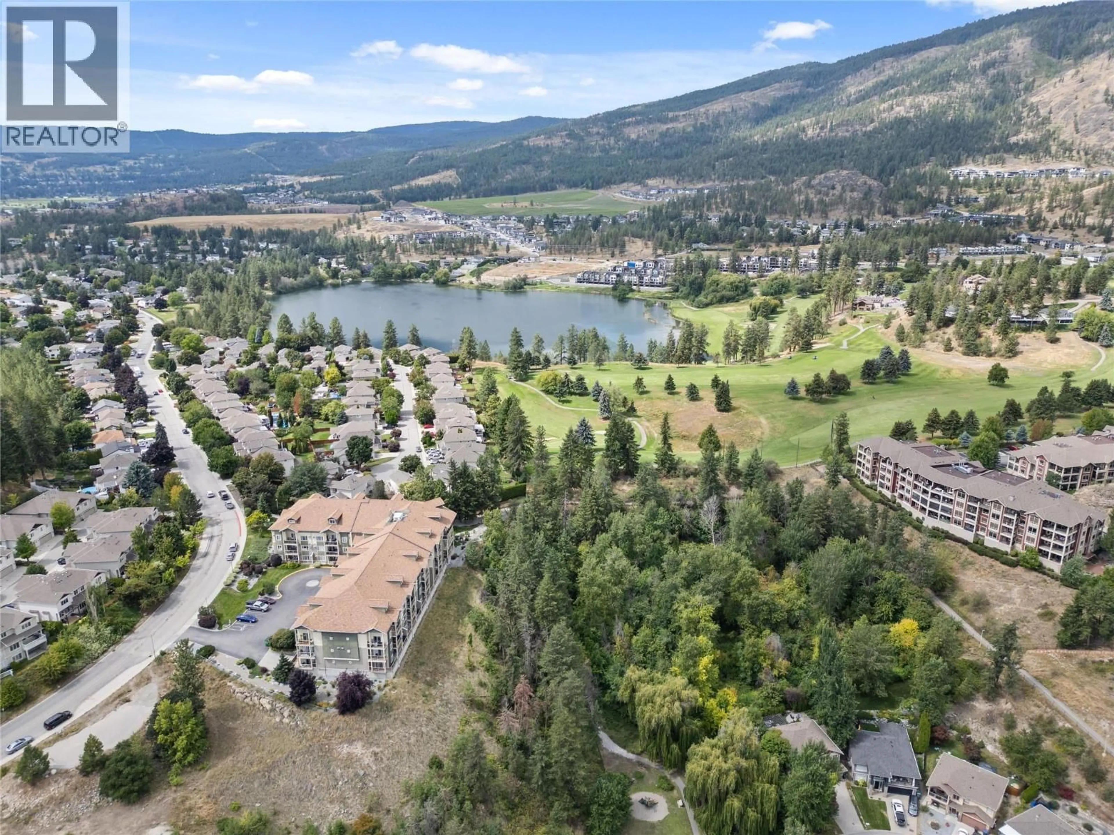 A pic from outside/outdoor area/front of a property/back of a property/a pic from drone, water/lake/river/ocean view for 102 - 2120 SHANNON RIDGE DRIVE, West Kelowna British Columbia V4T2Z3