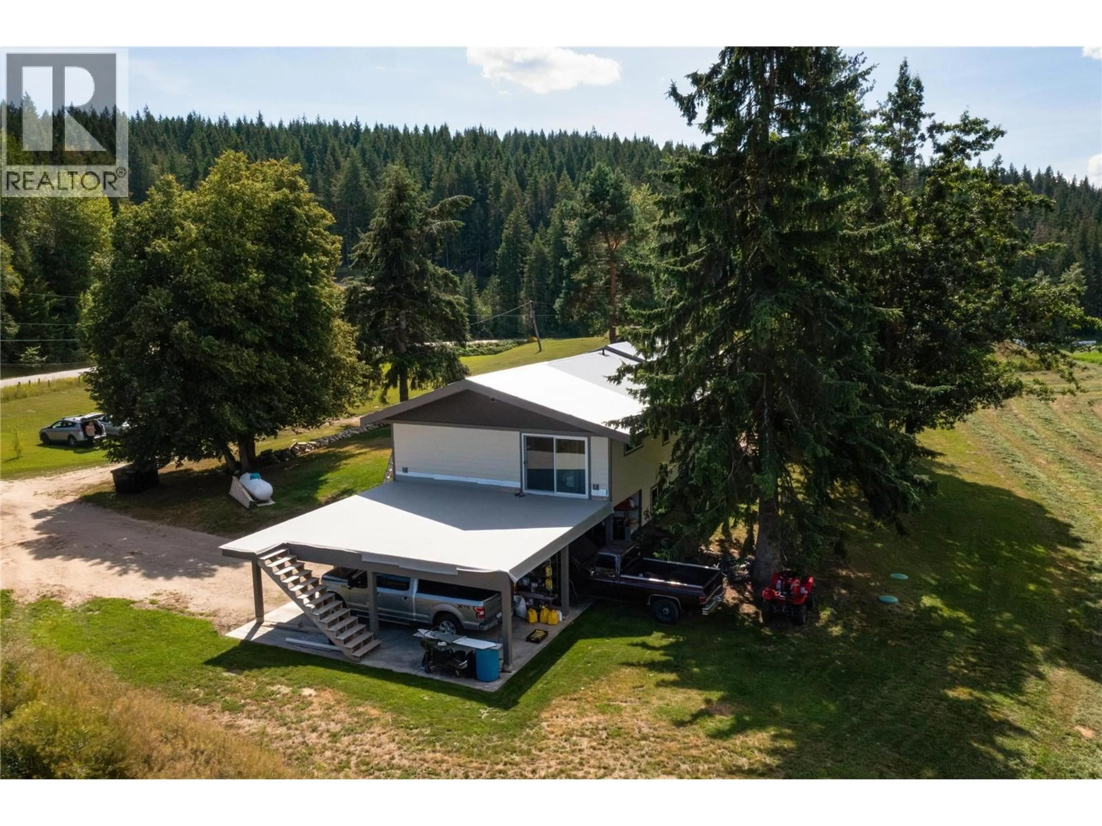 A pic from outside/outdoor area/front of a property/back of a property/a pic from drone, water/lake/river/ocean view for 414 MALLORY ROAD, Enderby British Columbia V4Y4H9