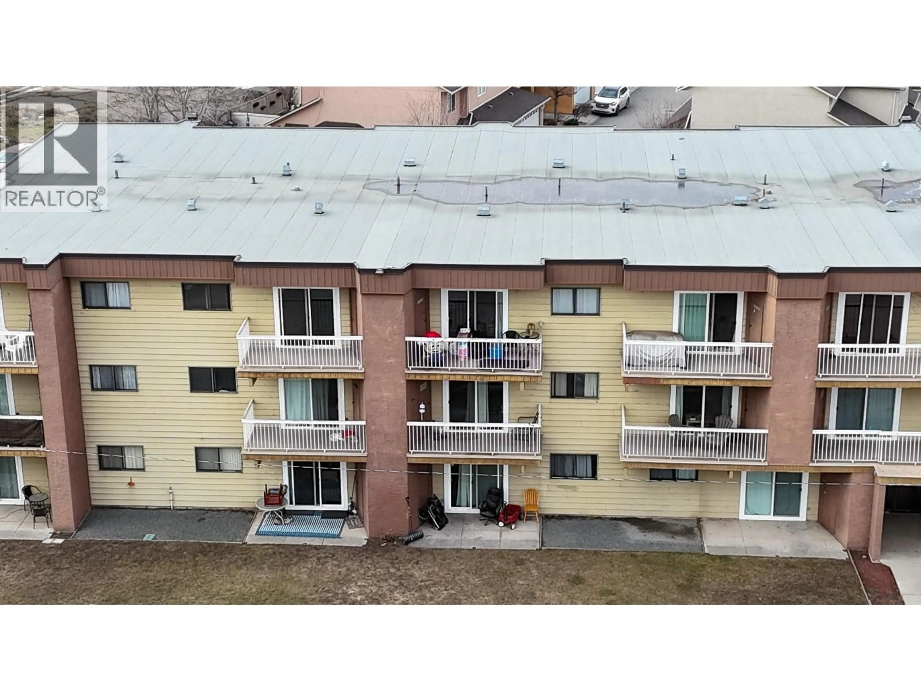 A pic from outside/outdoor area/front of a property/back of a property/a pic from drone, building for 303 - 1703 MENZIES STREET, Merritt British Columbia V1K1A6