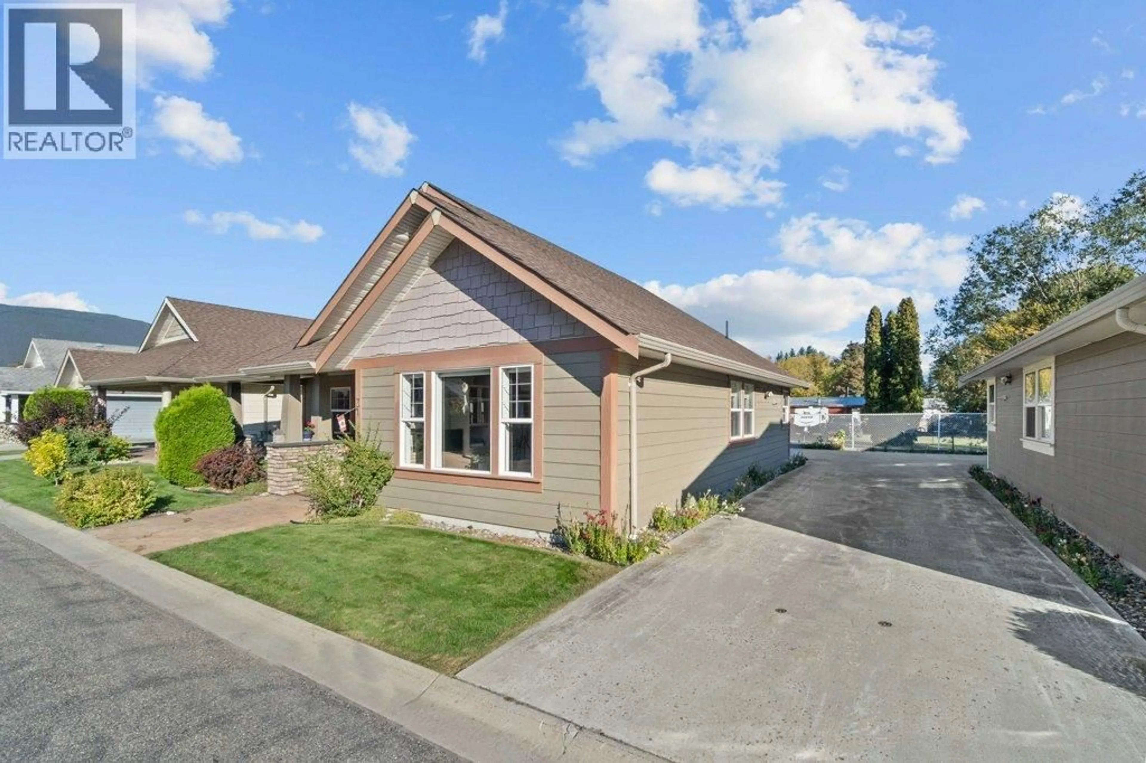A pic from outside/outdoor area/front of a property/back of a property/a pic from drone, street for 3 - 1231 10 STREET SOUTHWEST, Salmon Arm British Columbia V1E0A5