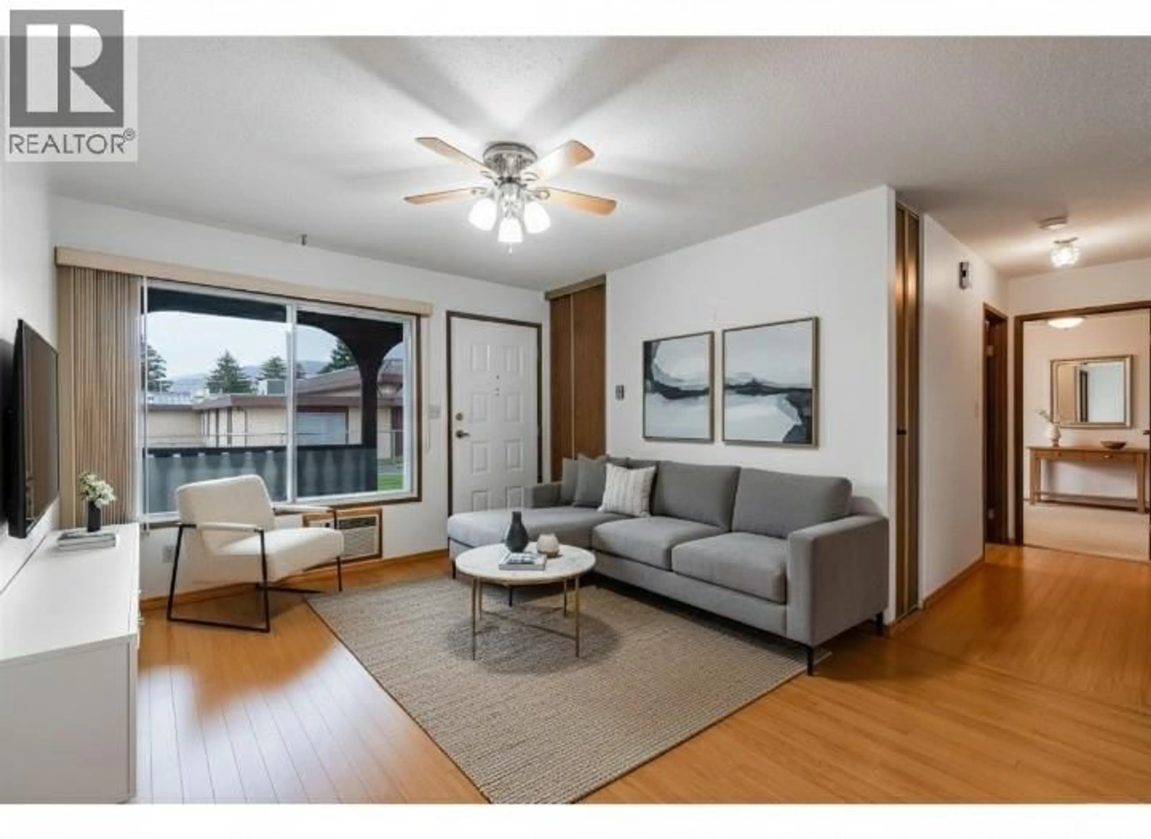 Living room with furniture, wood/laminate floor for 3 - 5862 AIRPORT STREET, Oliver British Columbia V0H1T0