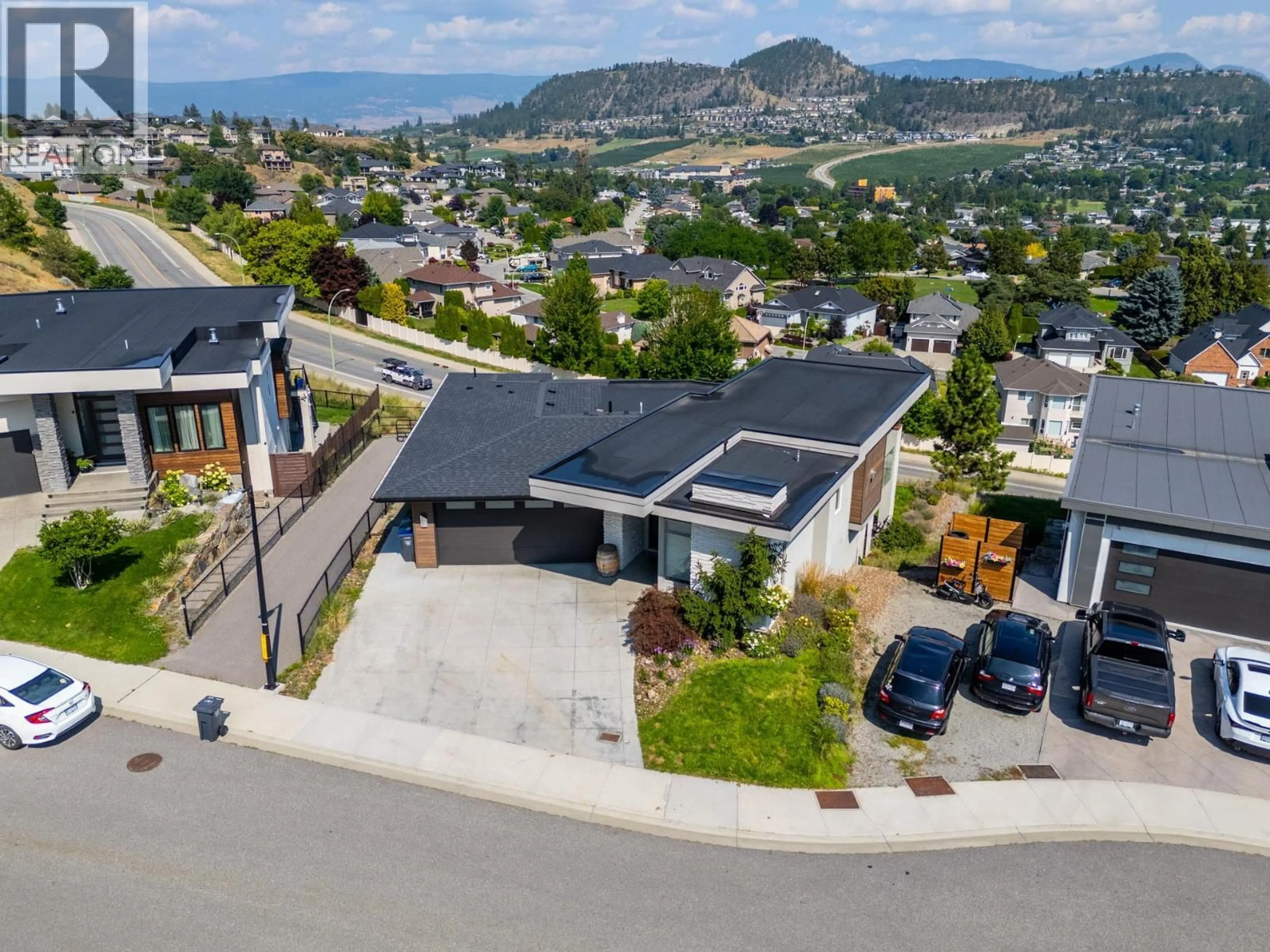 A pic from outside/outdoor area/front of a property/back of a property/a pic from drone, street for 1341 SLADEN CRESCENT, Kelowna British Columbia V1V2Y1