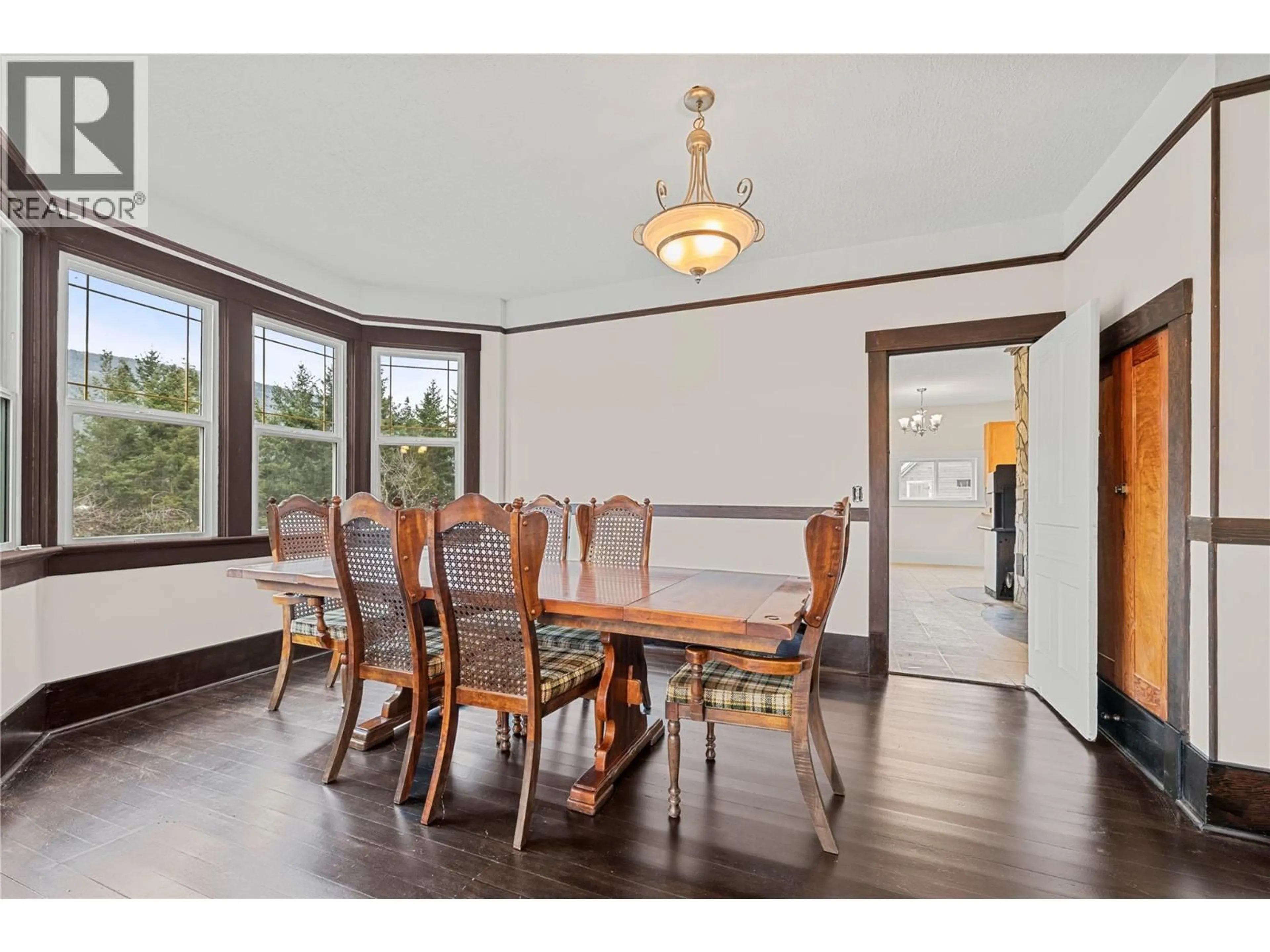 Dining room, wood/laminate floor for 3135 EDES ROAD, Salmon Arm British Columbia V1E3E9