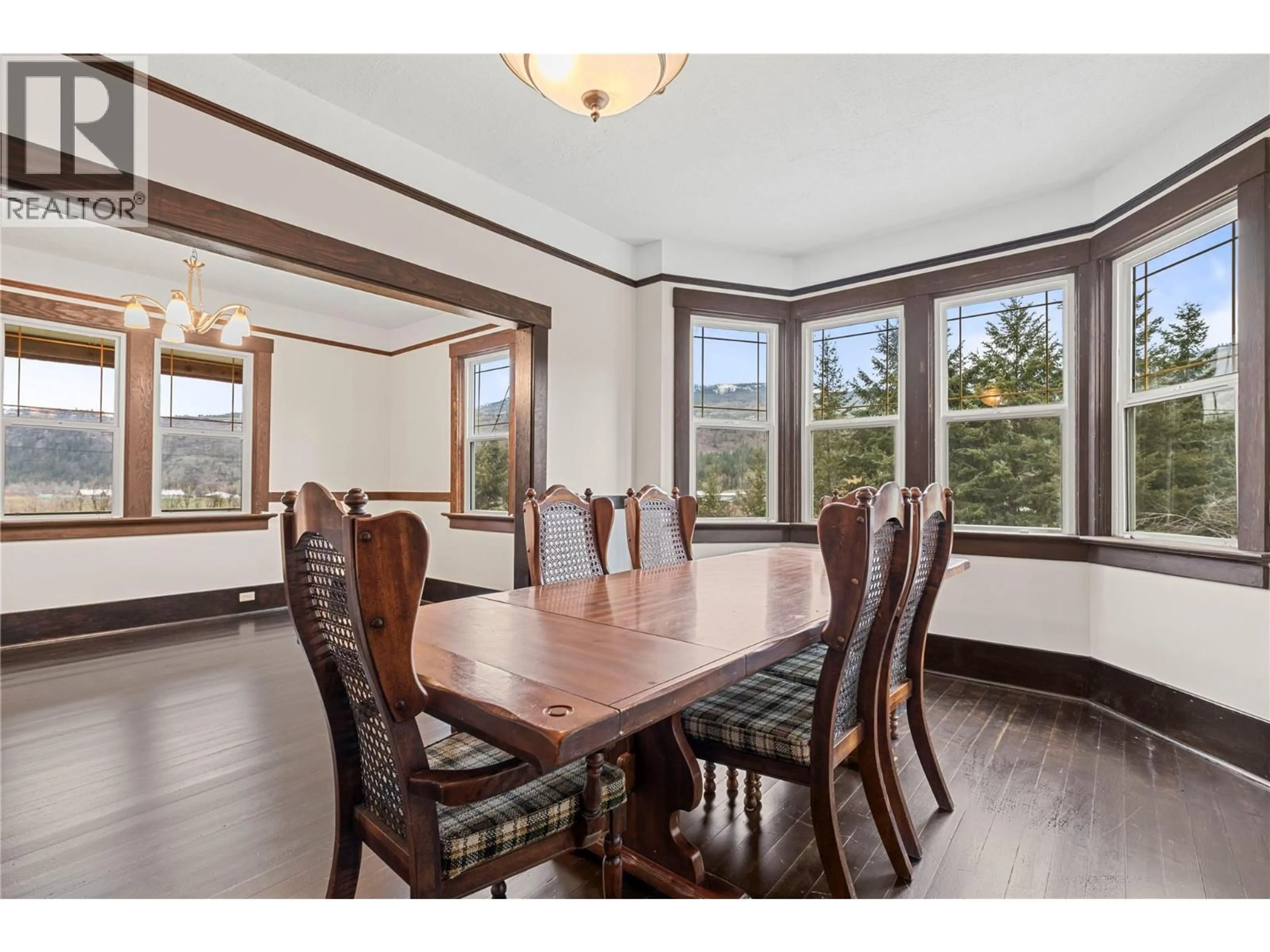 Dining room, wood/laminate floor for 3135 EDES ROAD, Salmon Arm British Columbia V1E3E9