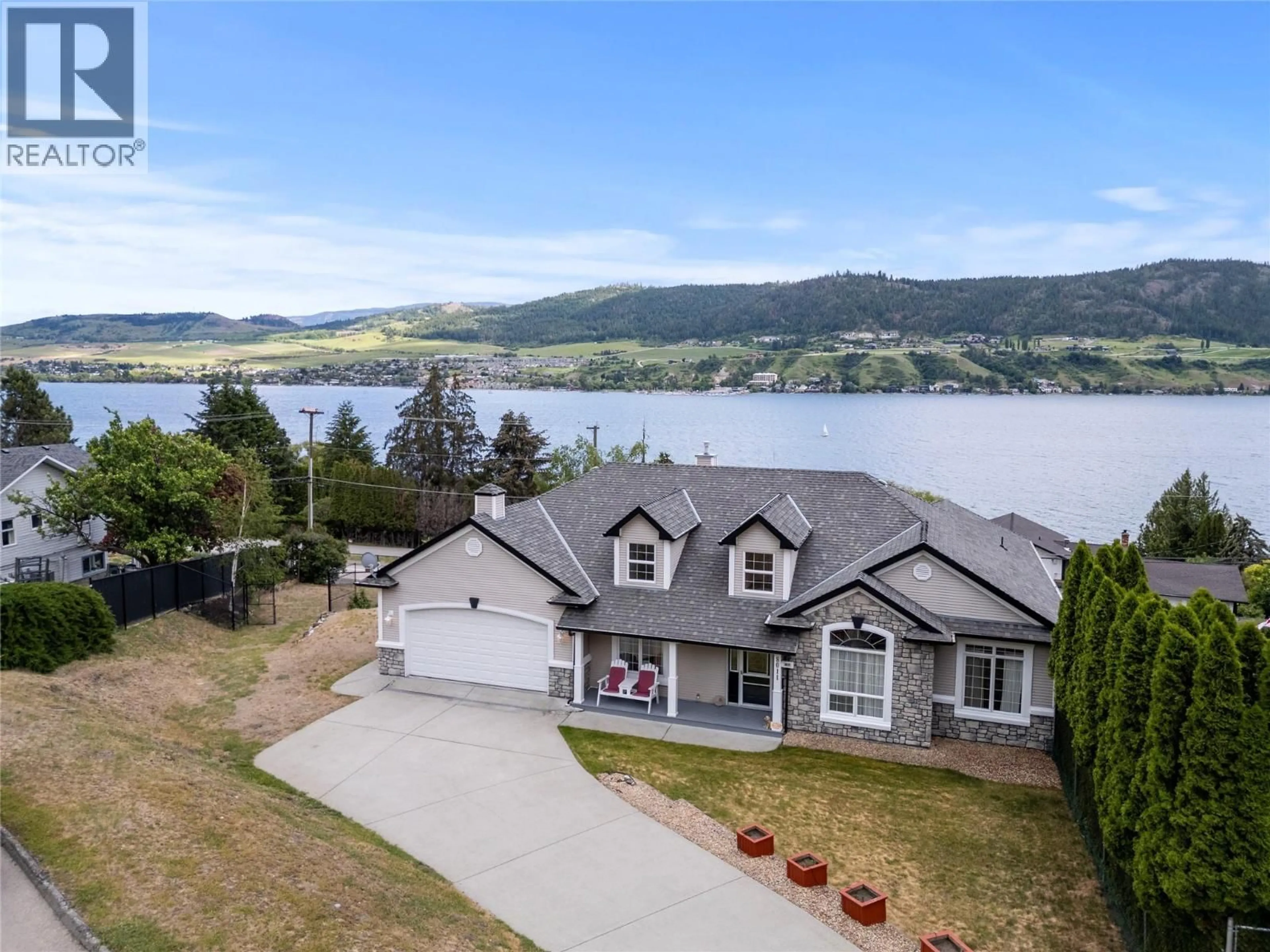 A pic from outside/outdoor area/front of a property/back of a property/a pic from drone, water/lake/river/ocean view for 8011 AQUARIUS ROAD, Vernon British Columbia V1H1C8