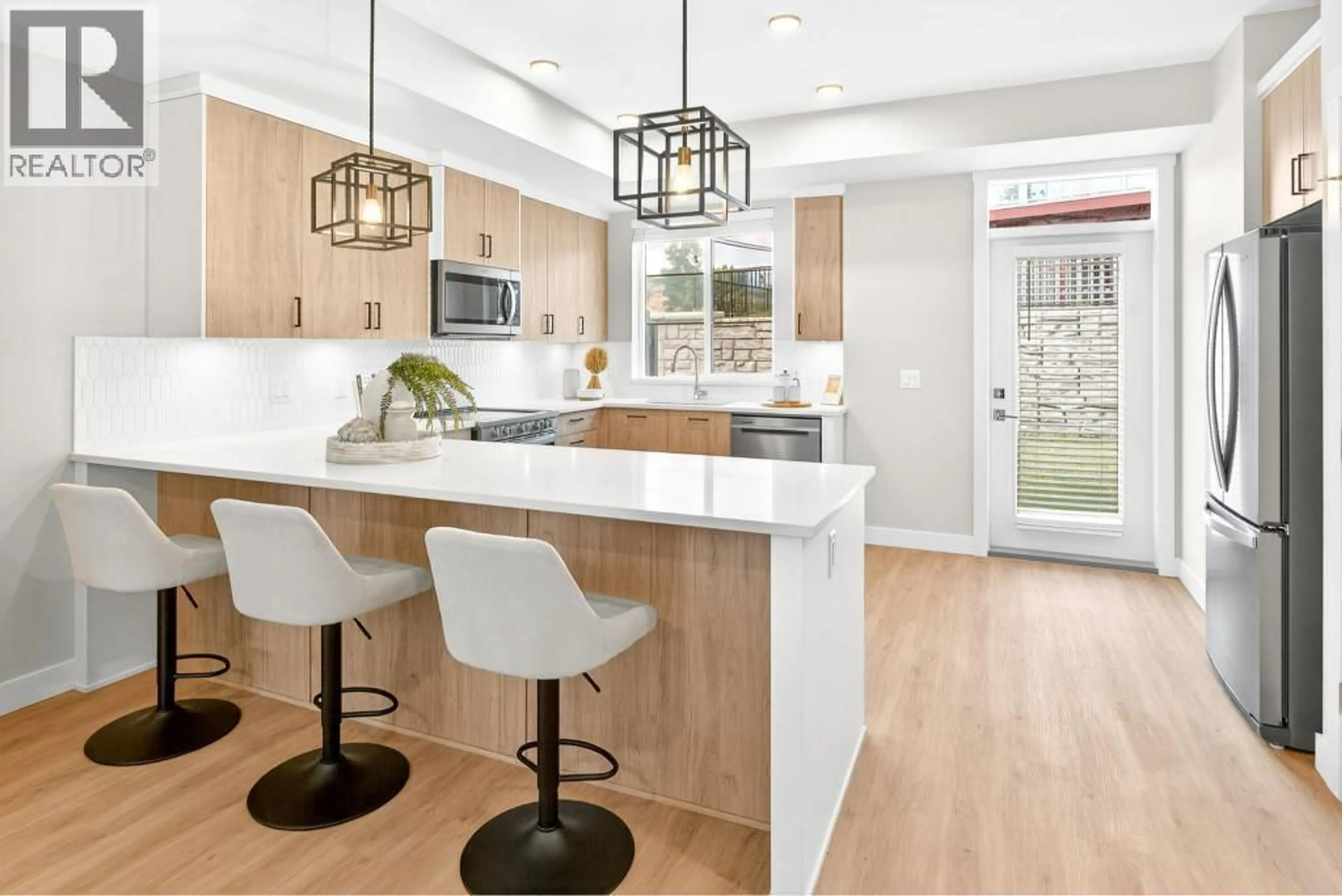 Open concept kitchen, wood/laminate floor for 191 - 4025 GELLATLY ROAD SOUTH, West Kelowna British Columbia V4T0E6