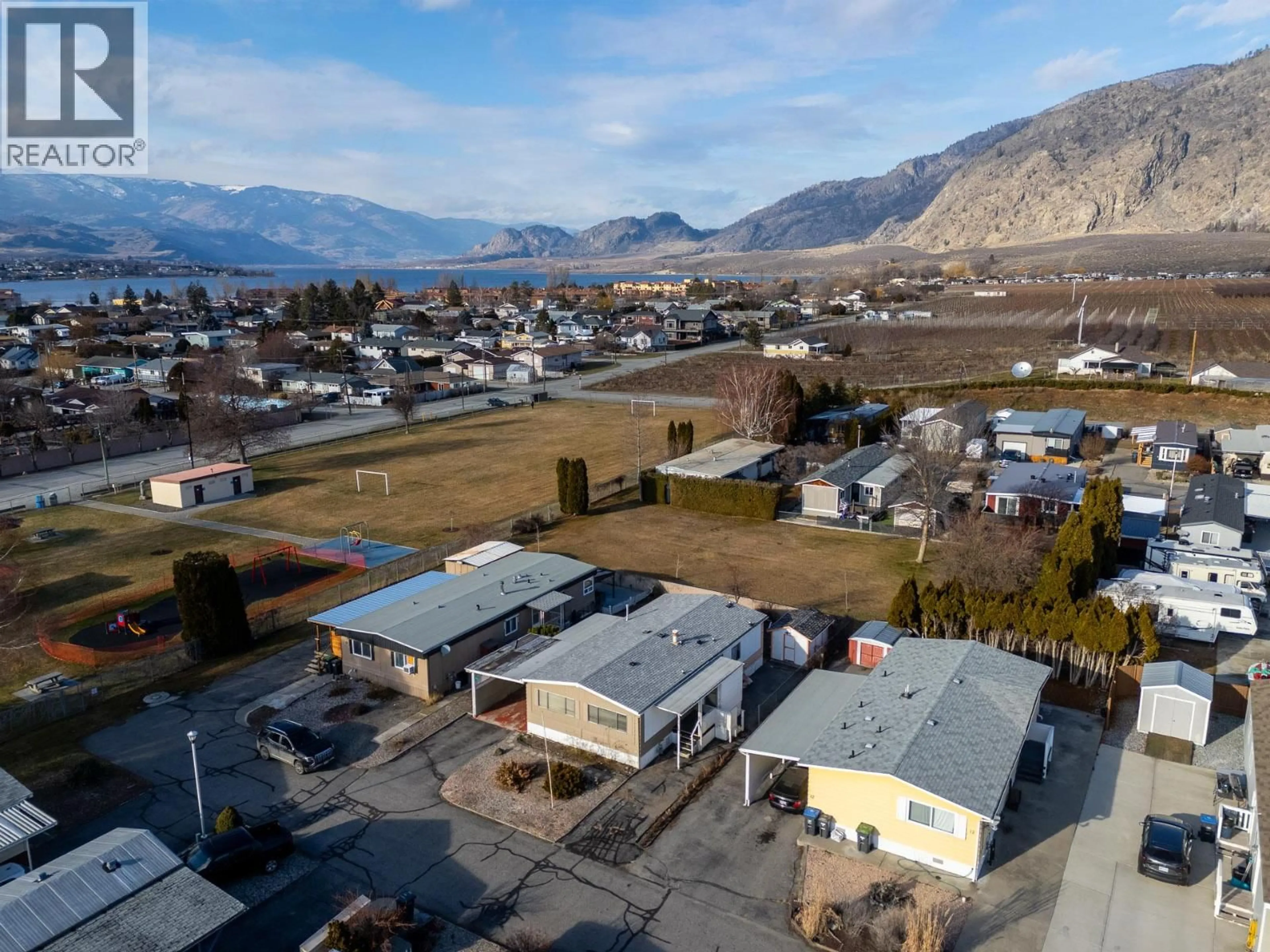 A pic from outside/outdoor area/front of a property/back of a property/a pic from drone, mountain view for 11 - 4911 CEDAR LANE, Osoyoos British Columbia V0H1V3