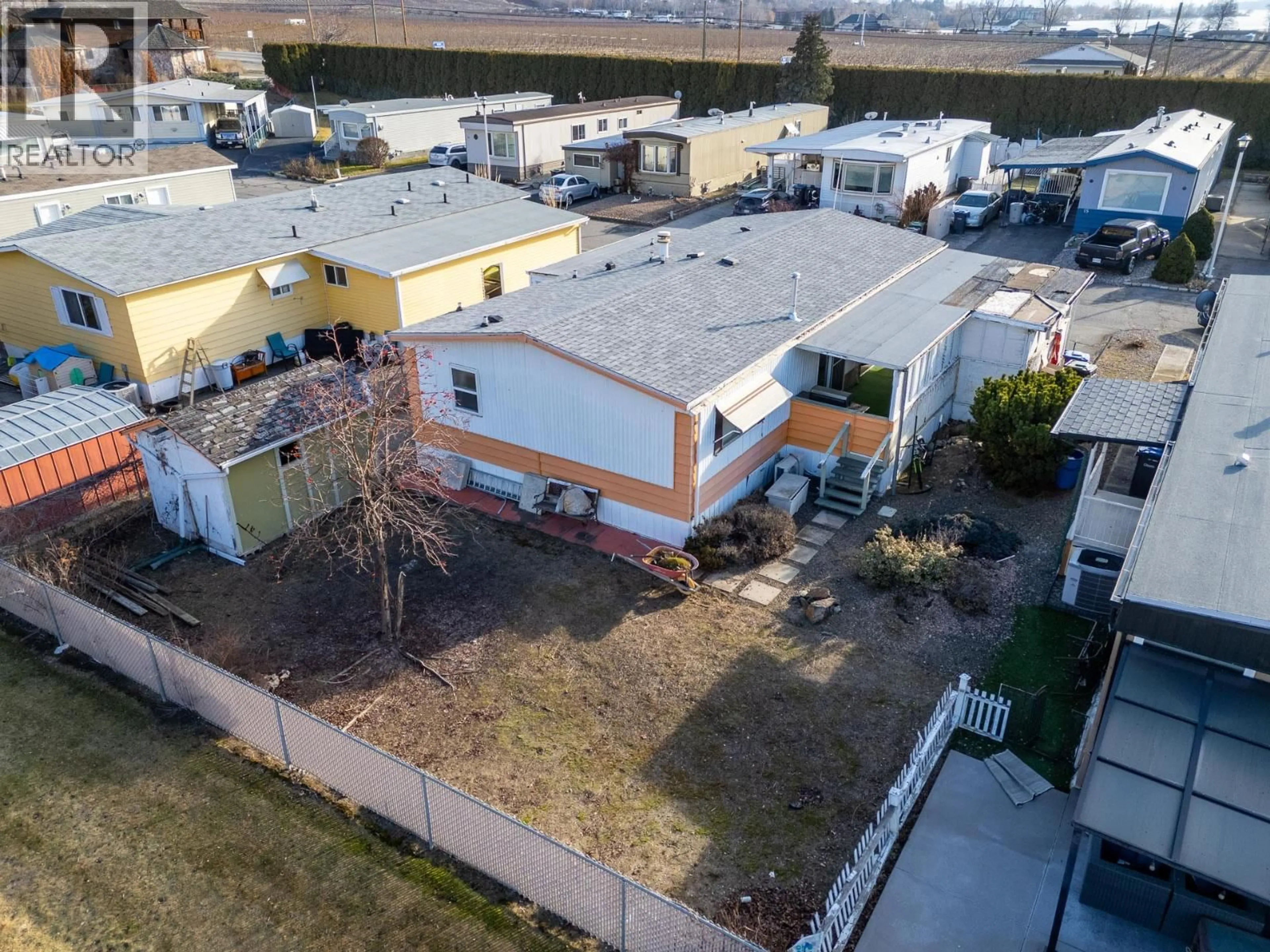 A pic from outside/outdoor area/front of a property/back of a property/a pic from drone, street for 11 - 4911 CEDAR LANE, Osoyoos British Columbia V0H1V3