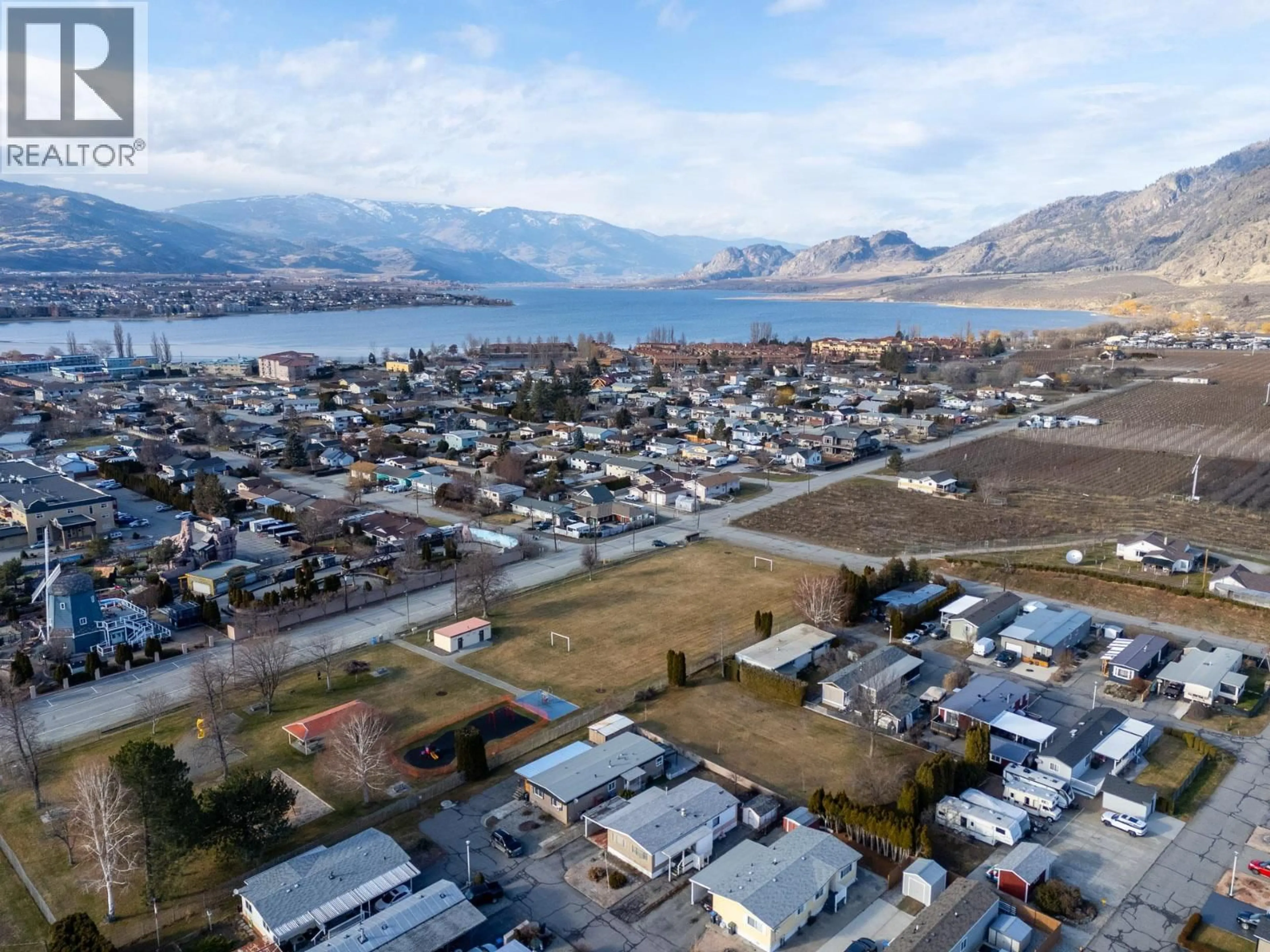 A pic from outside/outdoor area/front of a property/back of a property/a pic from drone, mountain view for 11 - 4911 CEDAR LANE, Osoyoos British Columbia V0H1V3