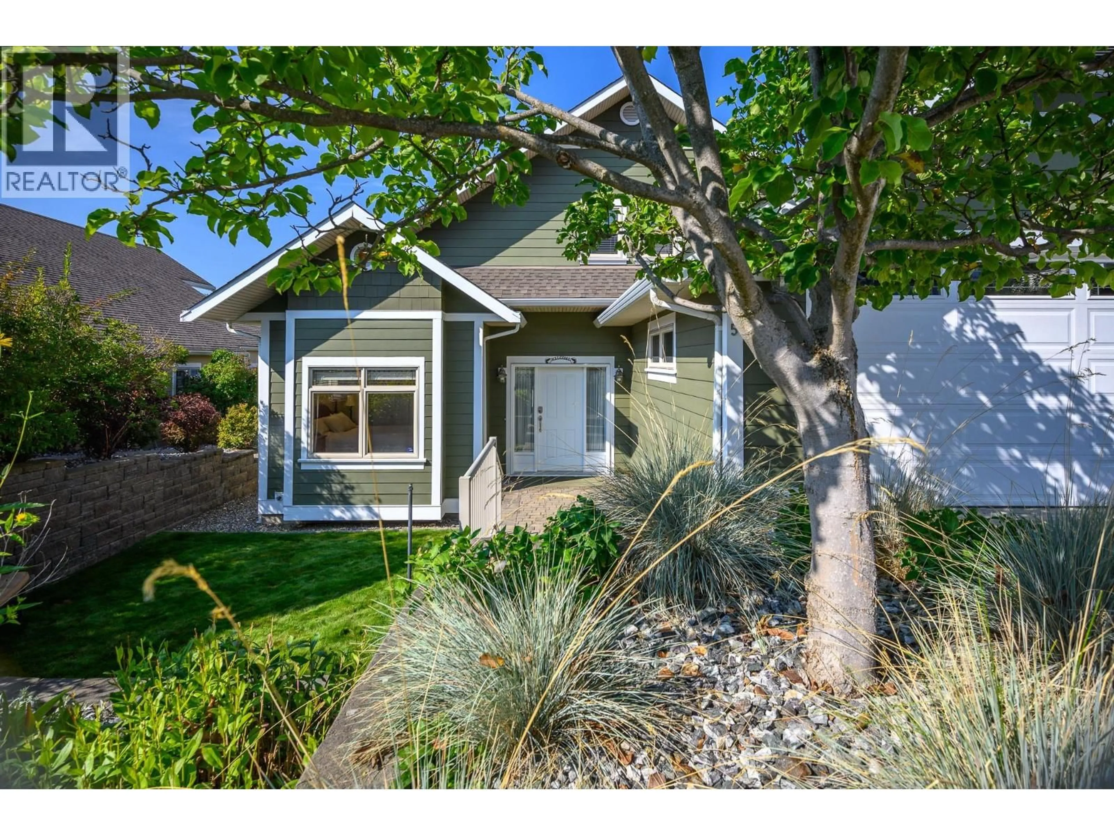 Home with vinyl exterior material, street for 5 - 7769 OKANAGAN LANDING ROAD, Vernon British Columbia V1H1V9