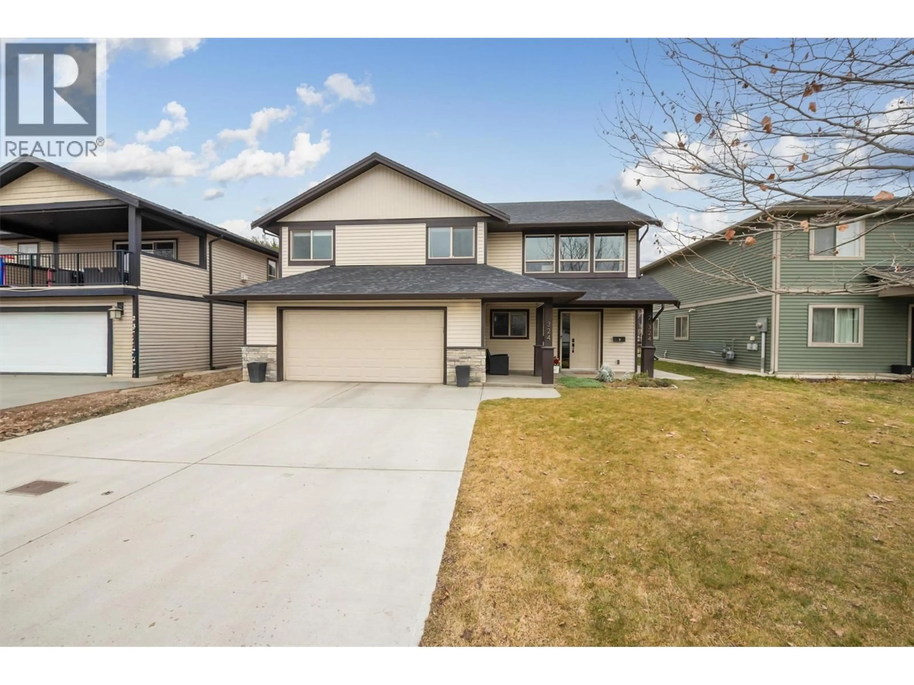 Home with vinyl exterior material, street for 324 ARAB ROAD, Kelowna British Columbia V1V3A8