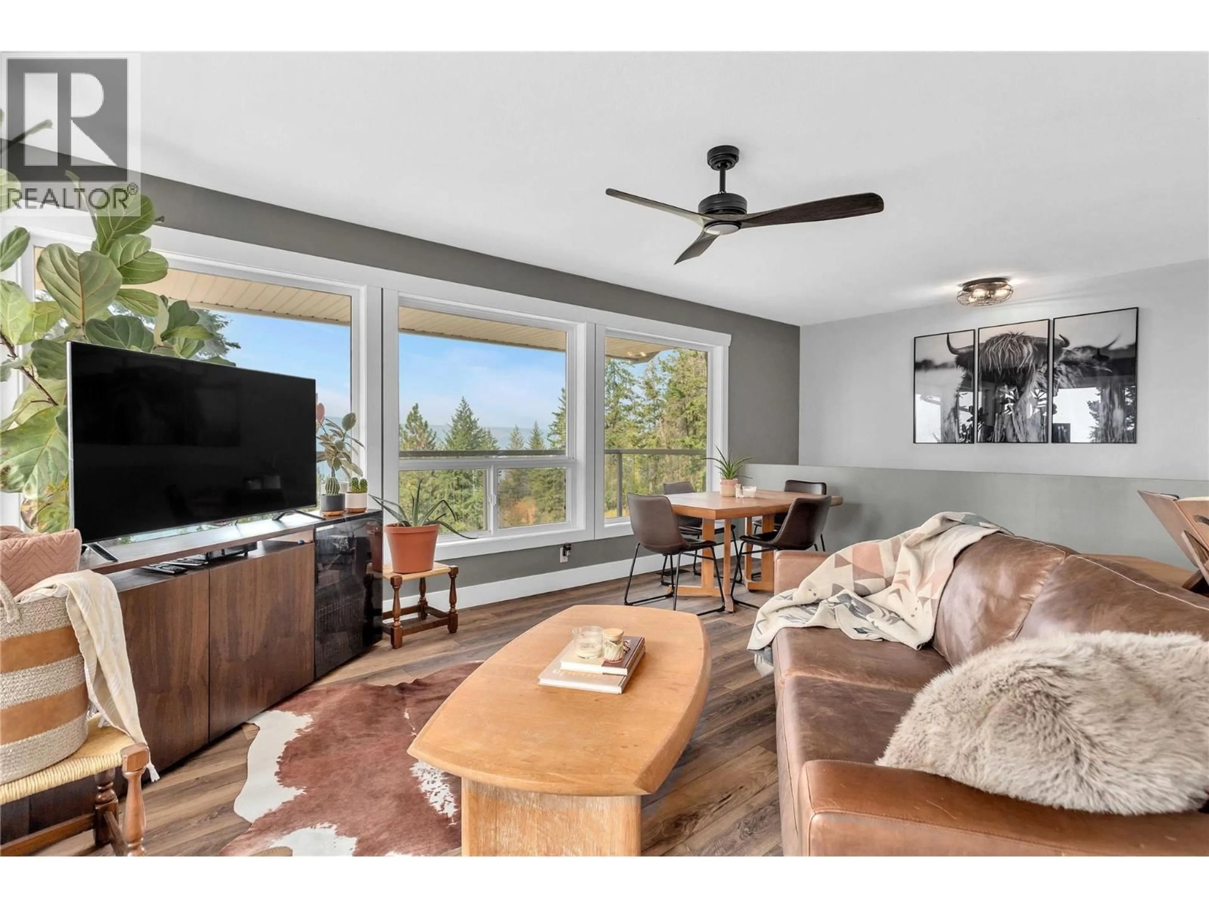 Living room with furniture, wood/laminate floor for 6011 OYAMA LAKE ROAD, Lake Country British Columbia V4V2C9