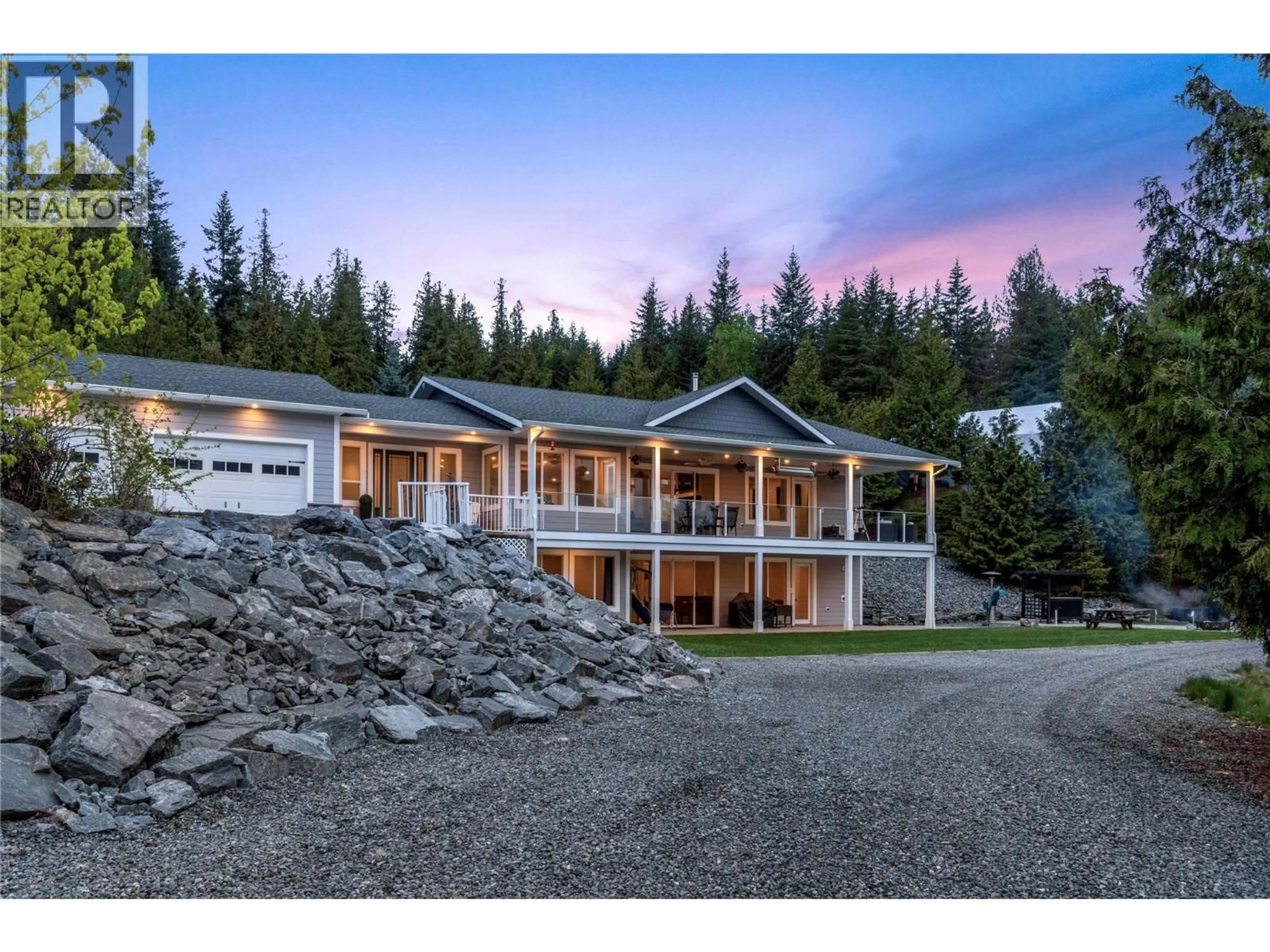 A pic from outside/outdoor area/front of a property/back of a property/a pic from drone, mountain view for 2030 CANOE BEACH DRIVE NORTHEAST, Salmon Arm British Columbia V1E2M5