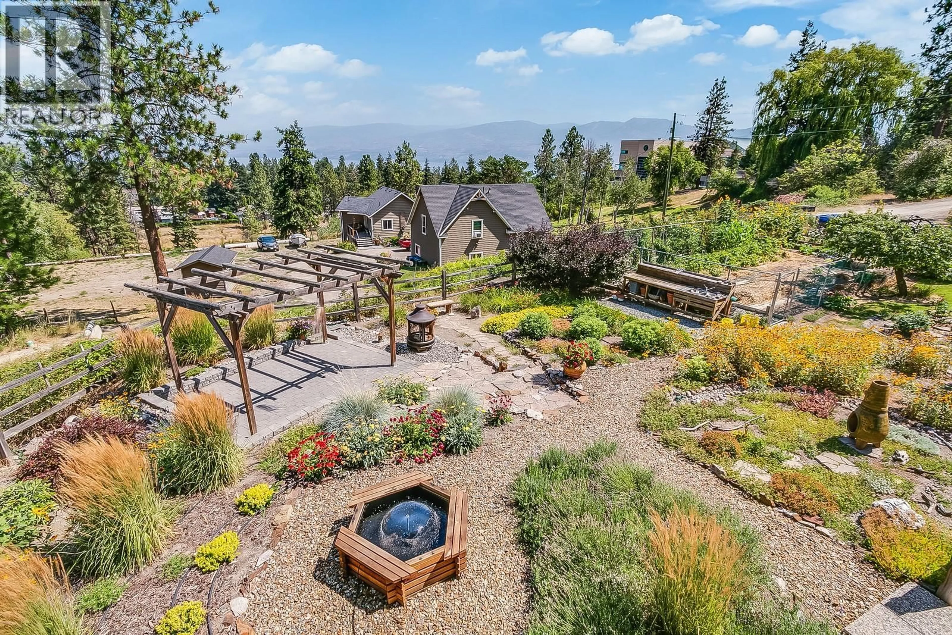 A pic from outside/outdoor area/front of a property/back of a property/a pic from drone, mountain view for 3535 MCIVER ROAD, Westbank British Columbia V4T1H8