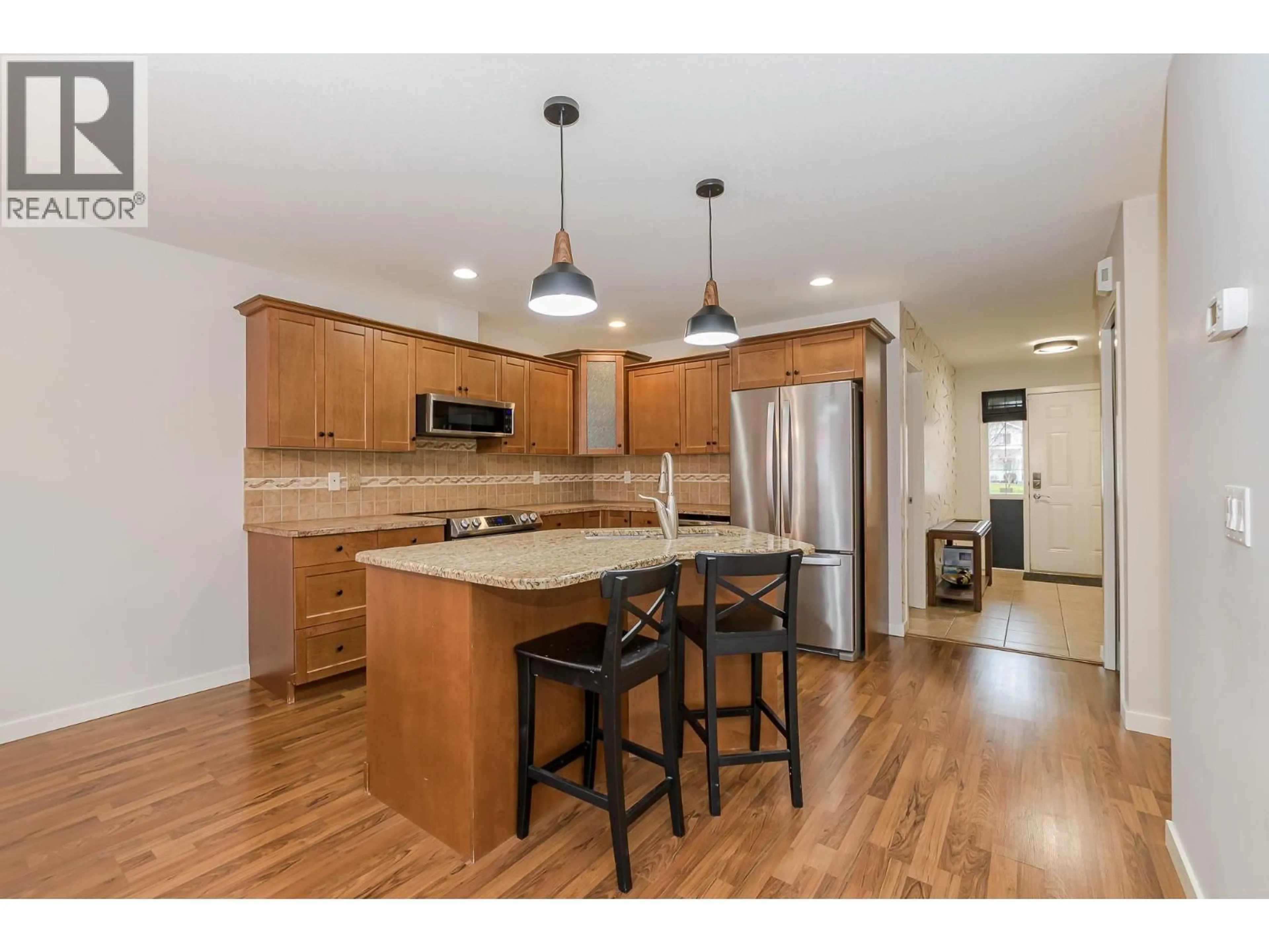 Open concept kitchen, wood/laminate floor for 104 - 222 MARTIN STREET, Sicamous British Columbia V0E2V0
