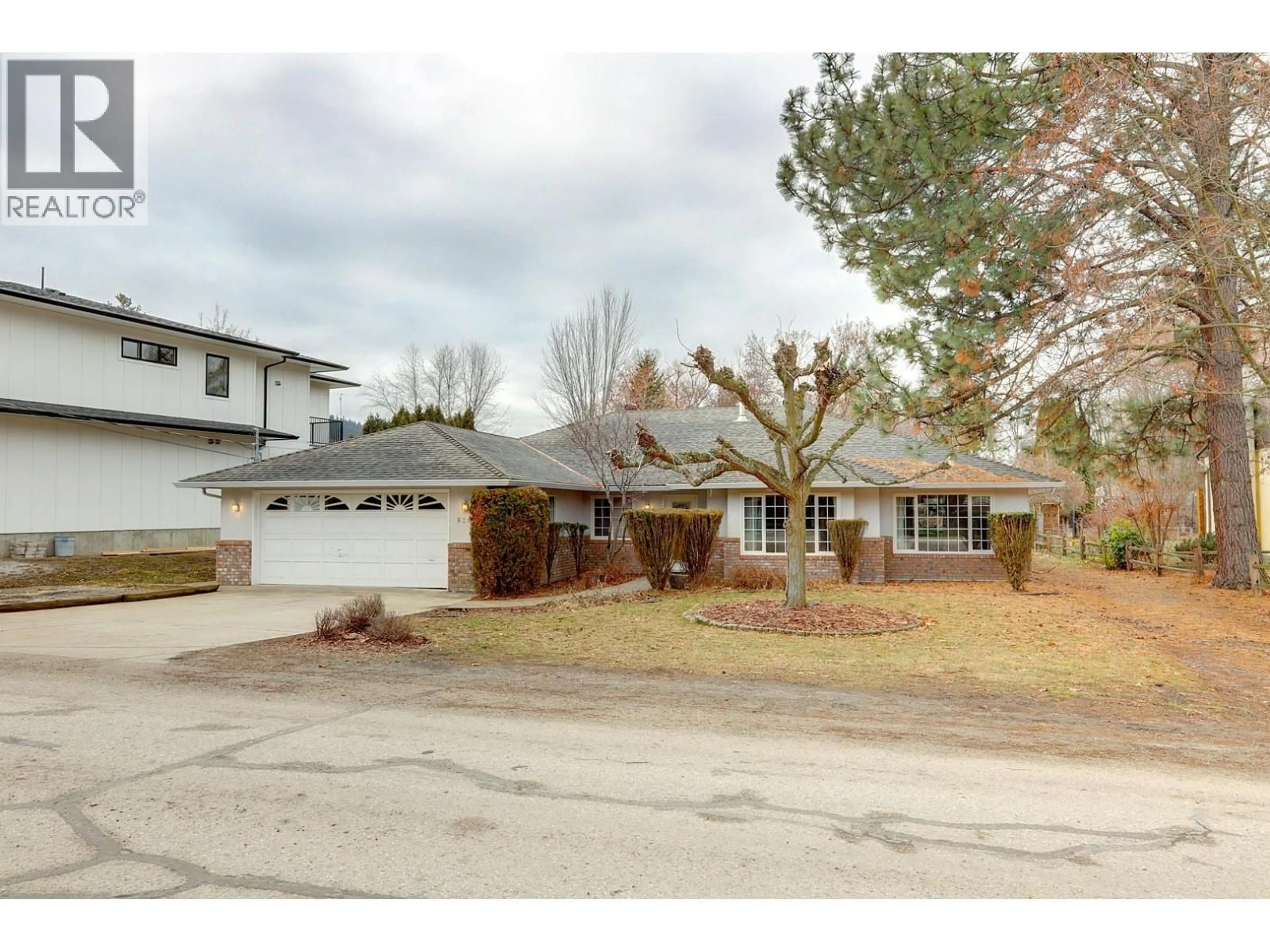 A pic from outside/outdoor area/front of a property/back of a property/a pic from drone, street for 8208 TEBO DRIVE, Coldstream British Columbia V1B1V3