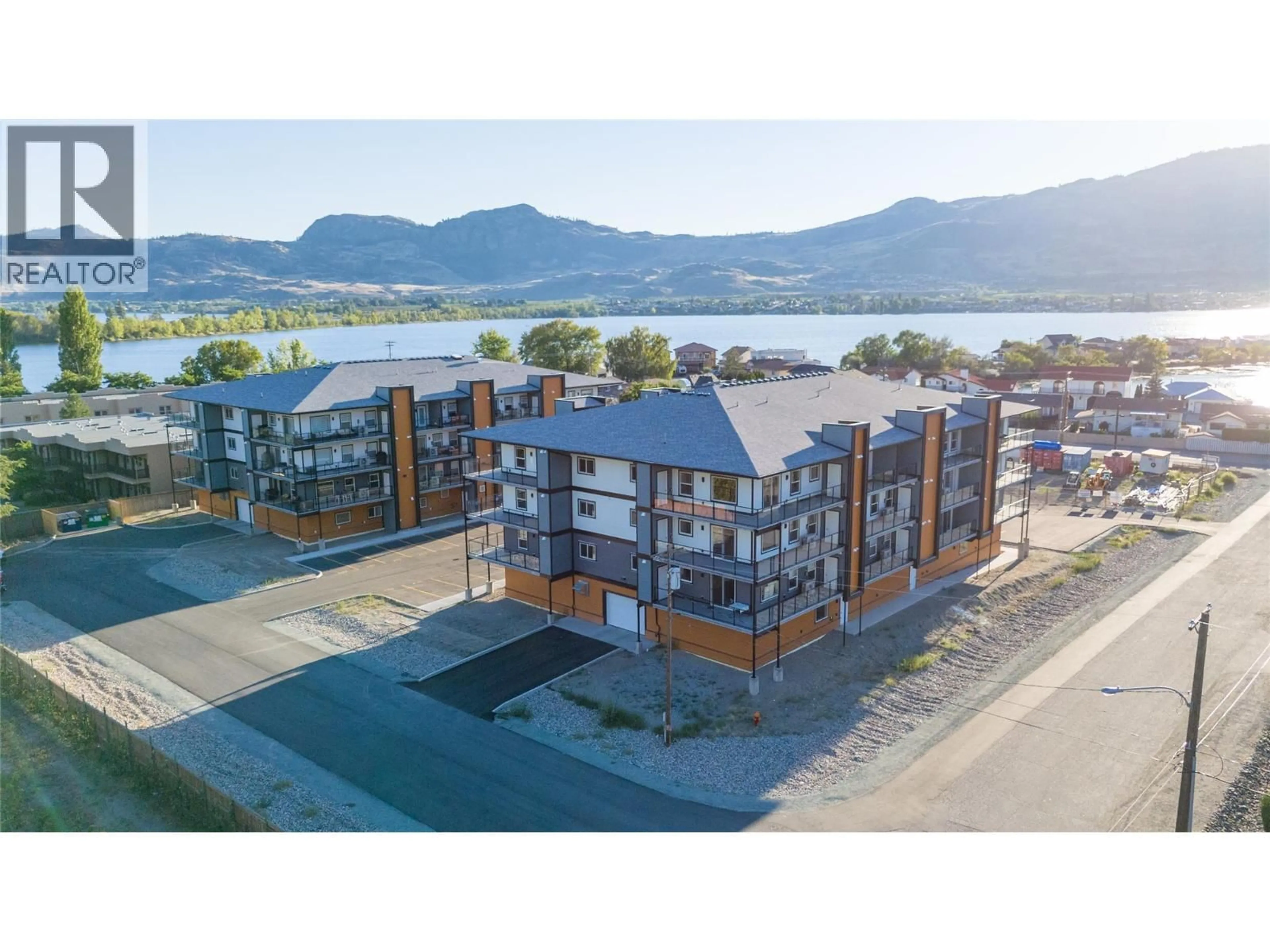 A pic from outside/outdoor area/front of a property/back of a property/a pic from drone, water/lake/river/ocean view for 307 - 5620 51ST STREET, Osoyoos British Columbia V0H1V6