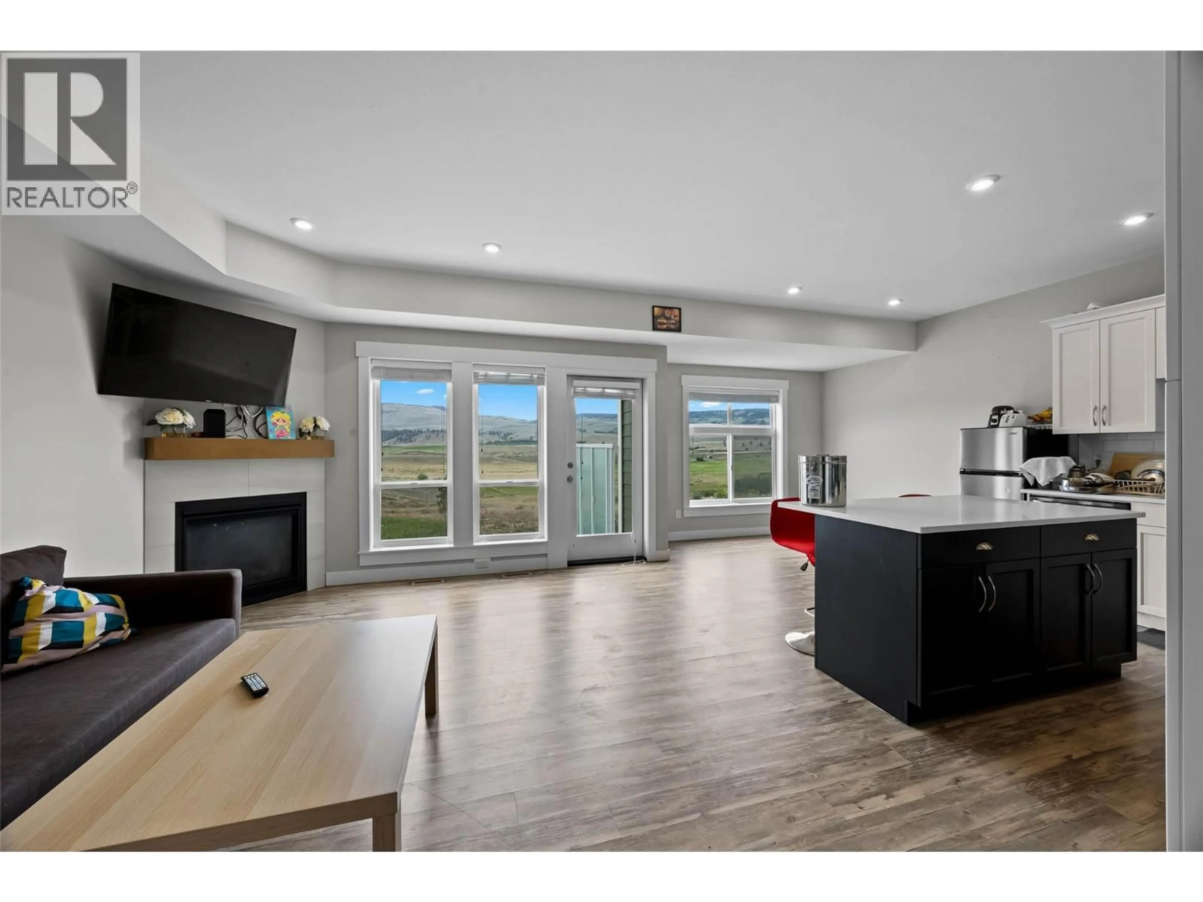 Open concept kitchen, wood/laminate floor for 209 - 2514 SPRING BANK AVENUE, Merritt British Columbia V1K0B1