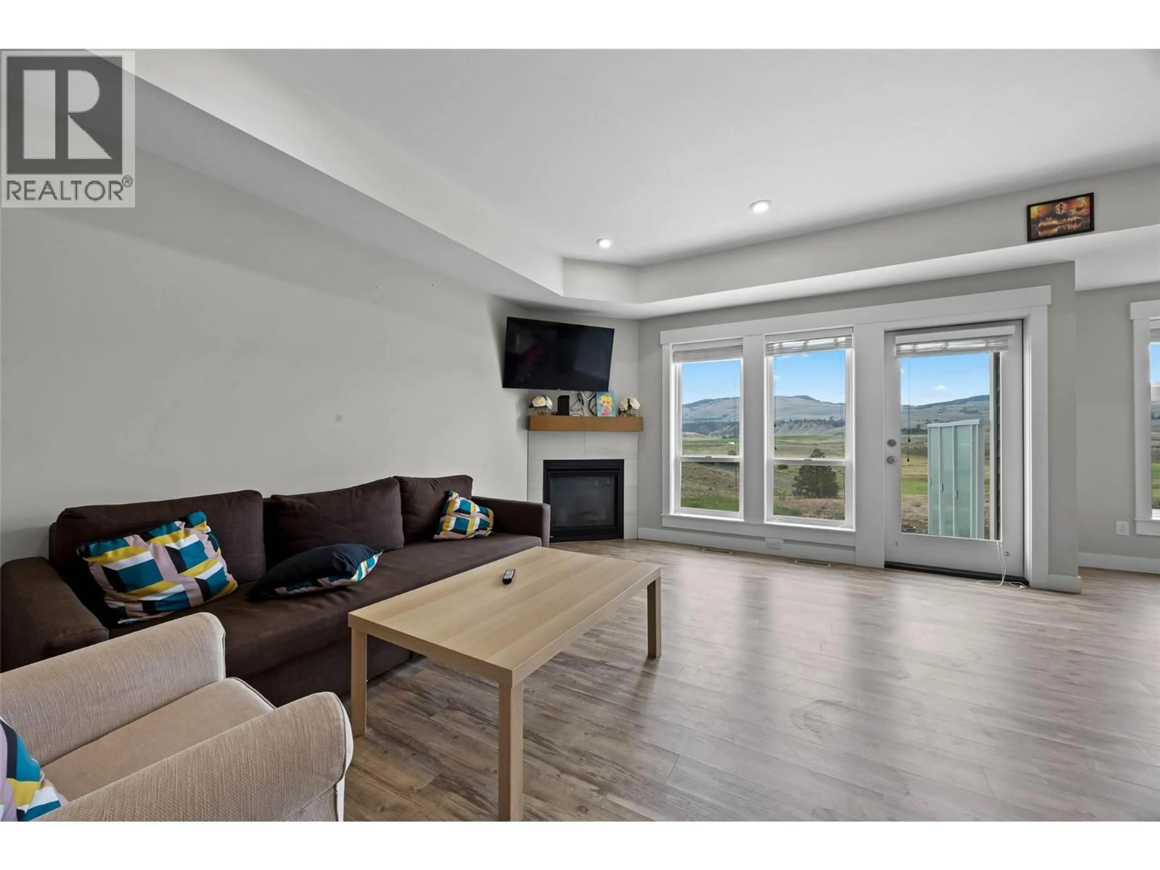 Living room with furniture, wood/laminate floor for 209 - 2514 SPRING BANK AVENUE, Merritt British Columbia V1K0B1