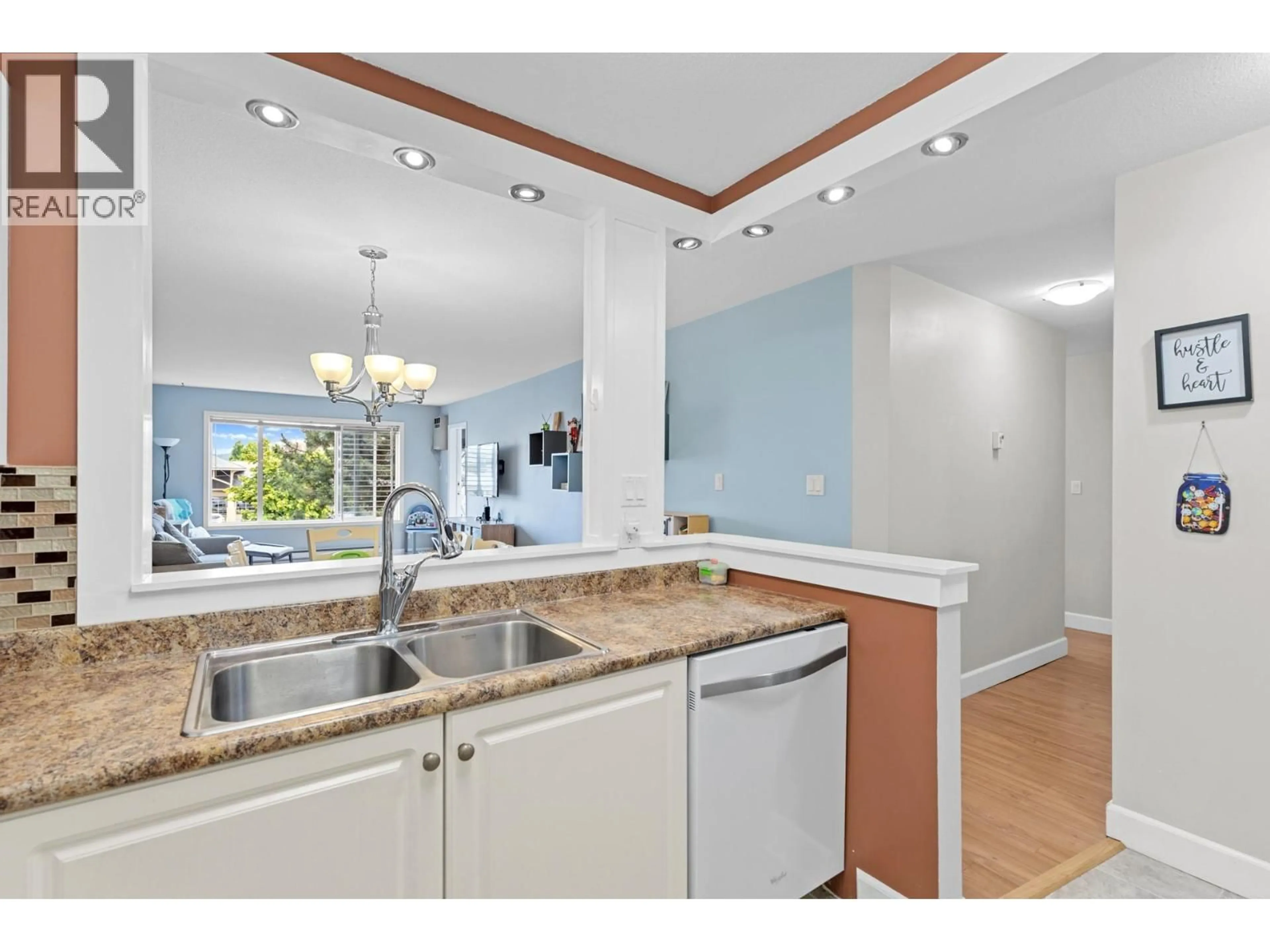 Open concept kitchen, ceramic/tile floor for 209 - 400 SUTTON CRESCENT, Kelowna British Columbia V1Y1Y3