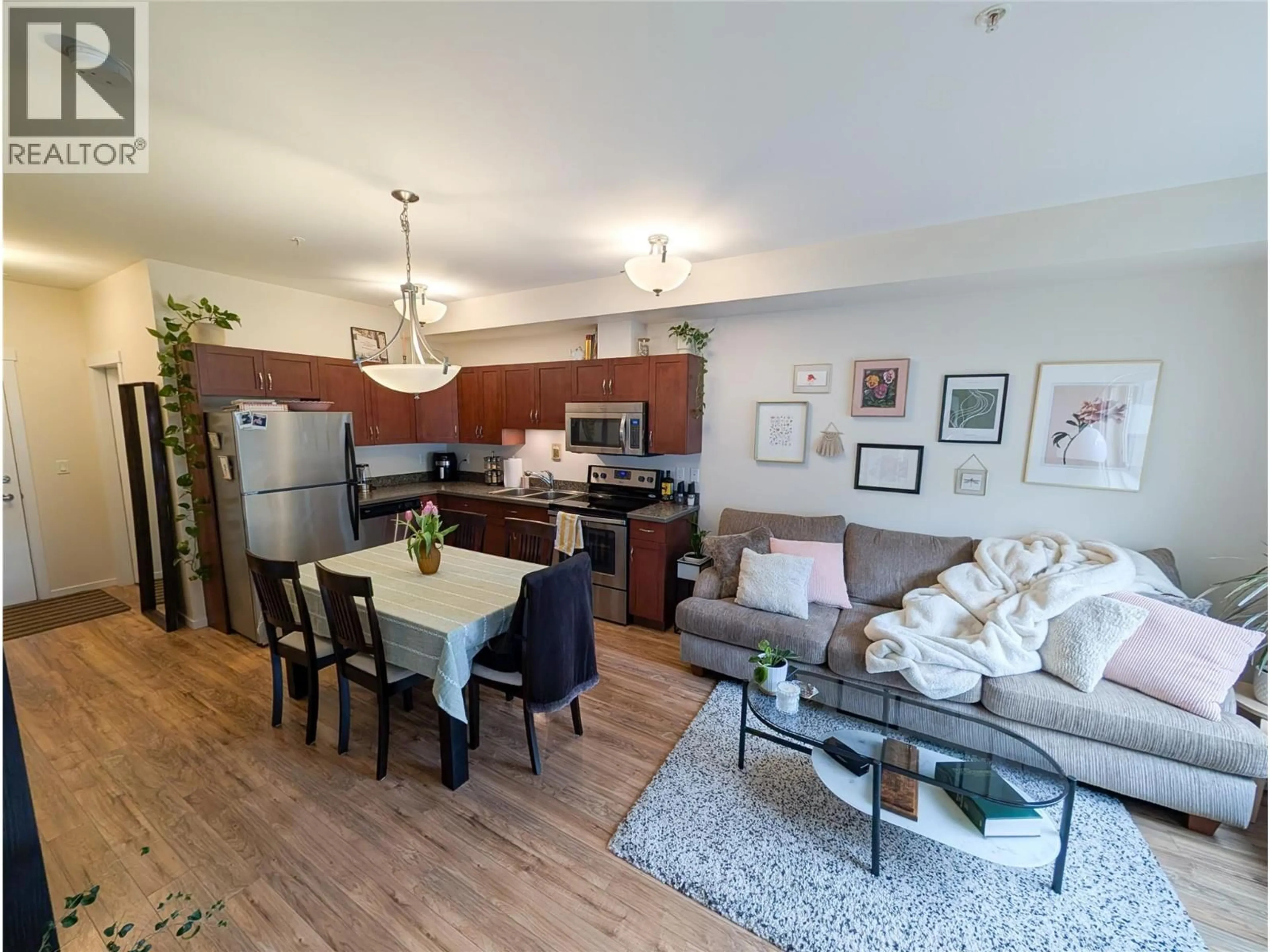 Open concept kitchen, wood/laminate floor for 209 - 429 ST PAUL STREET, Kamloops British Columbia V2C2J7