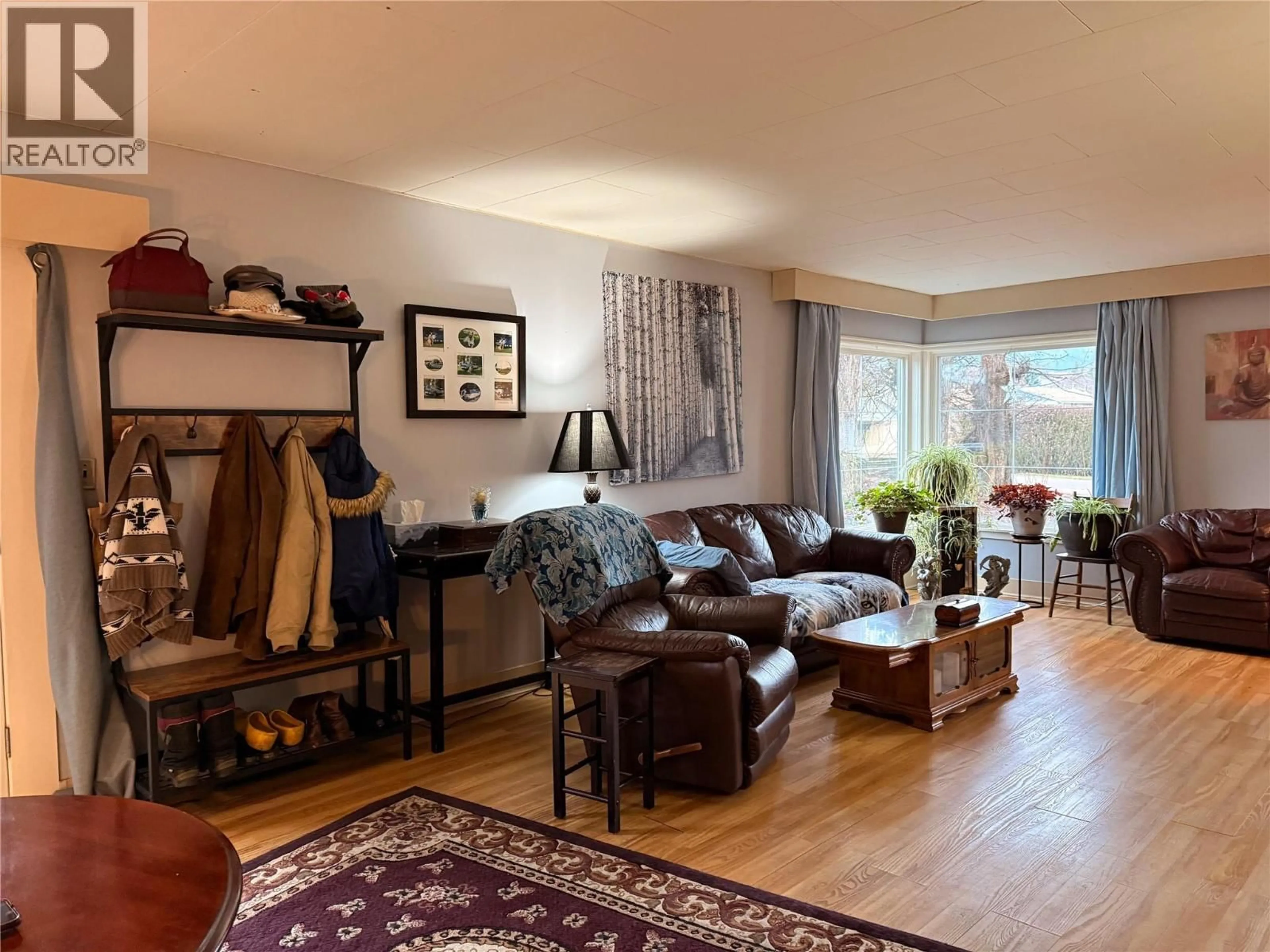 Living room with furniture, wood/laminate floor for 2210 FLETCHER AVENUE, Armstrong British Columbia V0E1B1