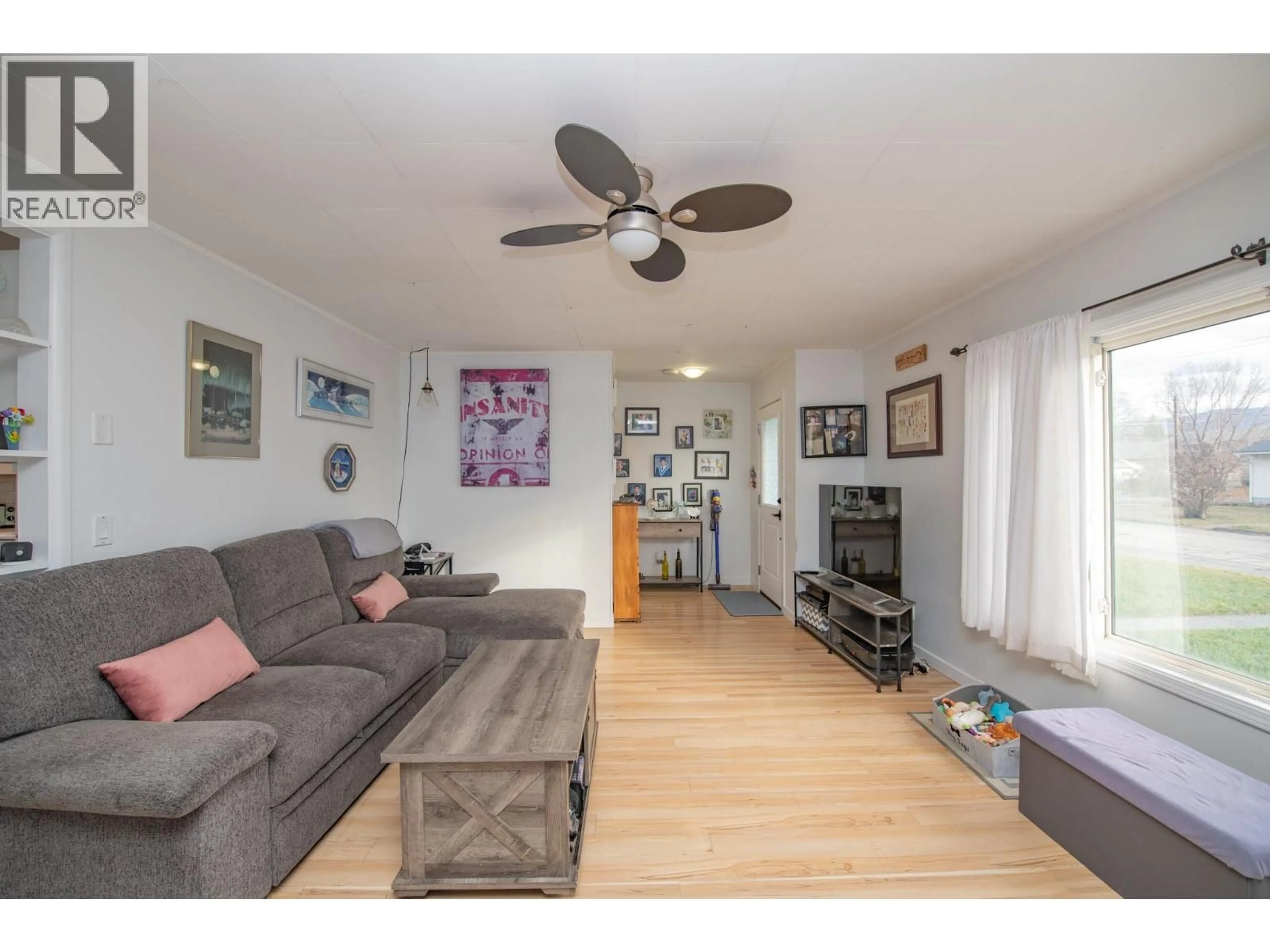 Living room with furniture, wood/laminate floor for 3905 28 AVENUE, Vernon British Columbia v1t1x3