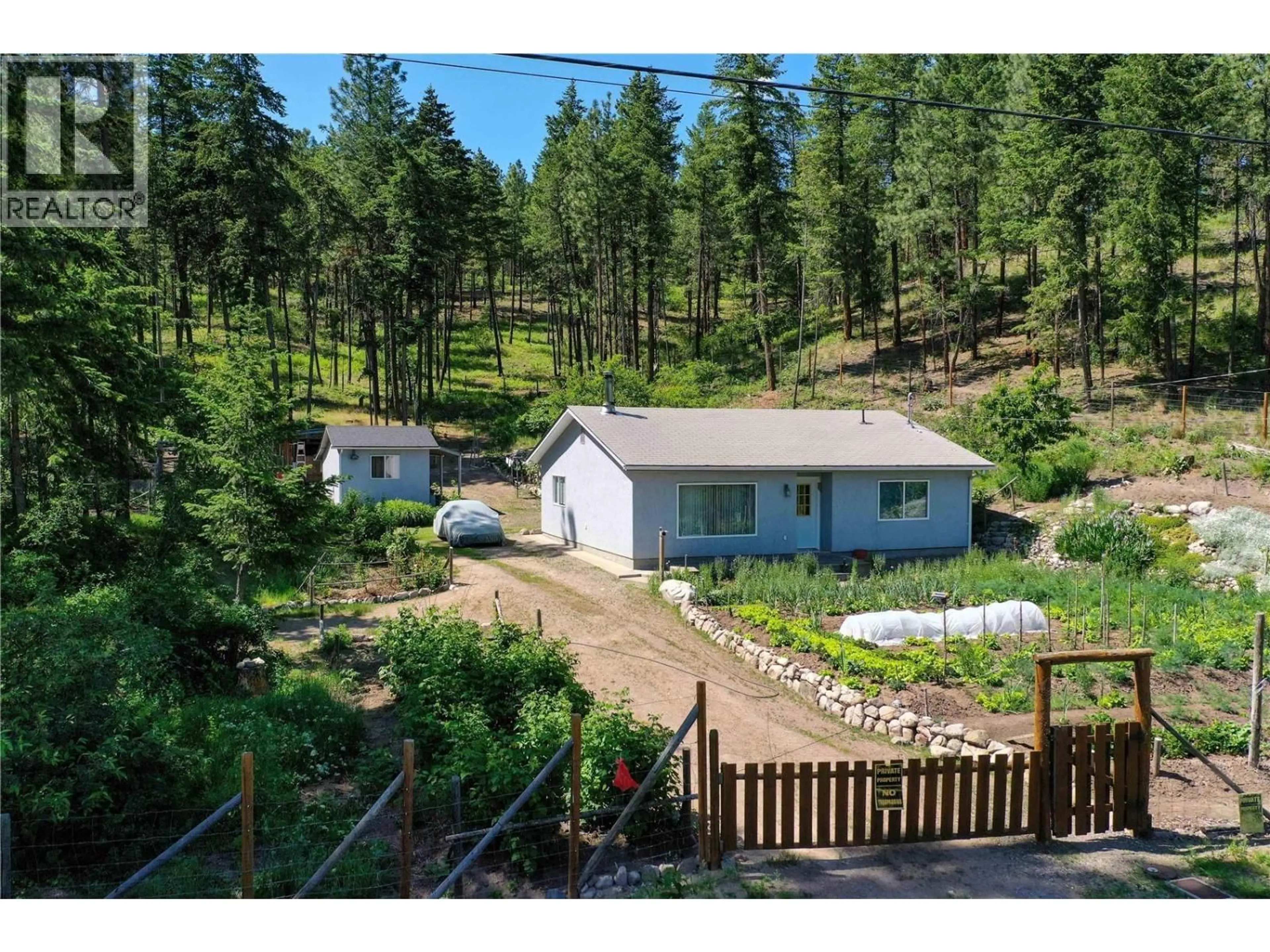 A pic from outside/outdoor area/front of a property/back of a property/a pic from drone, forest/trees view for 7410 SHALAL ROAD, Kelowna British Columbia V1Z3W7