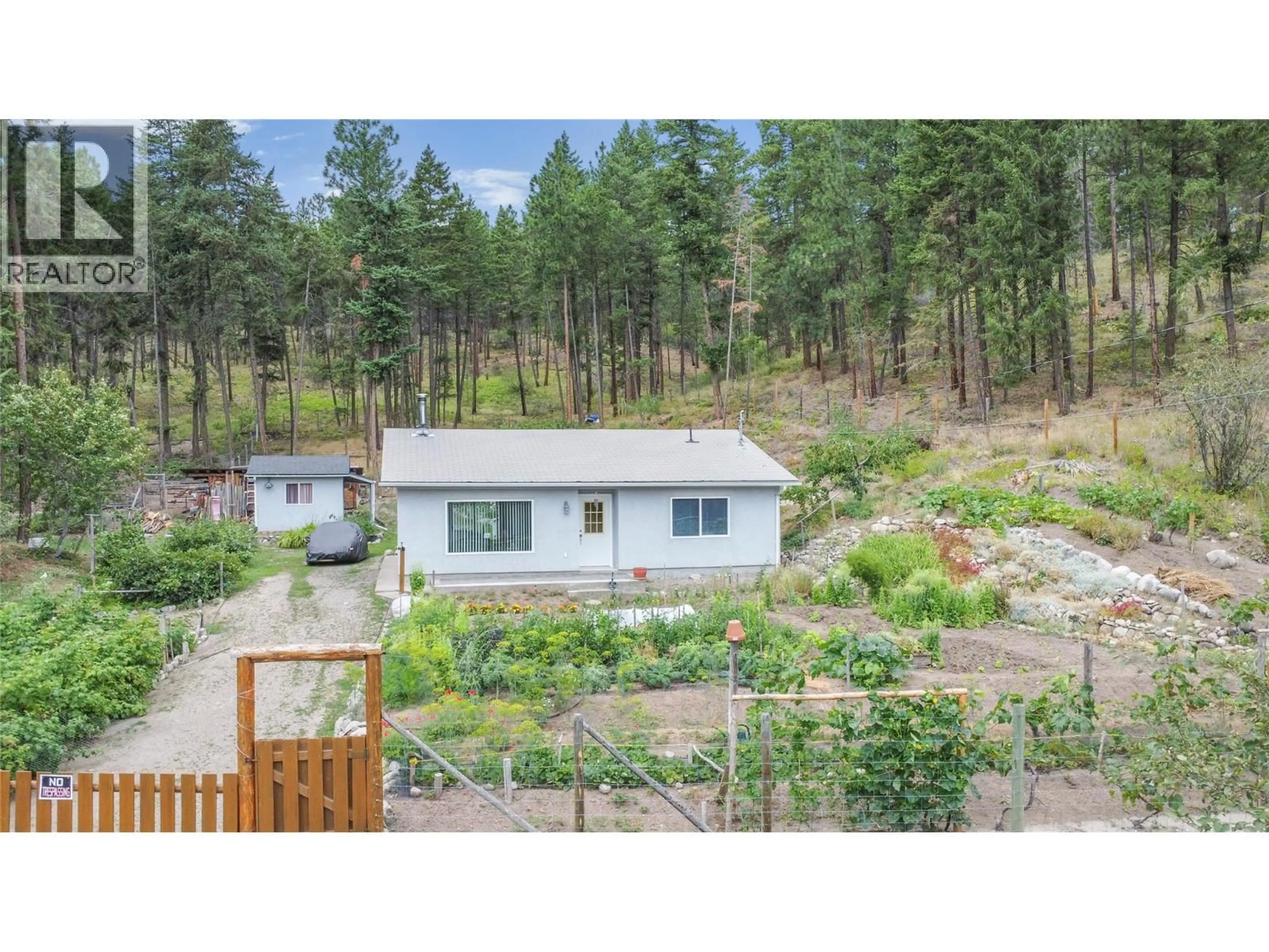 A pic from outside/outdoor area/front of a property/back of a property/a pic from drone, forest/trees view for 7410 SHALAL ROAD, Kelowna British Columbia V1Z3W7