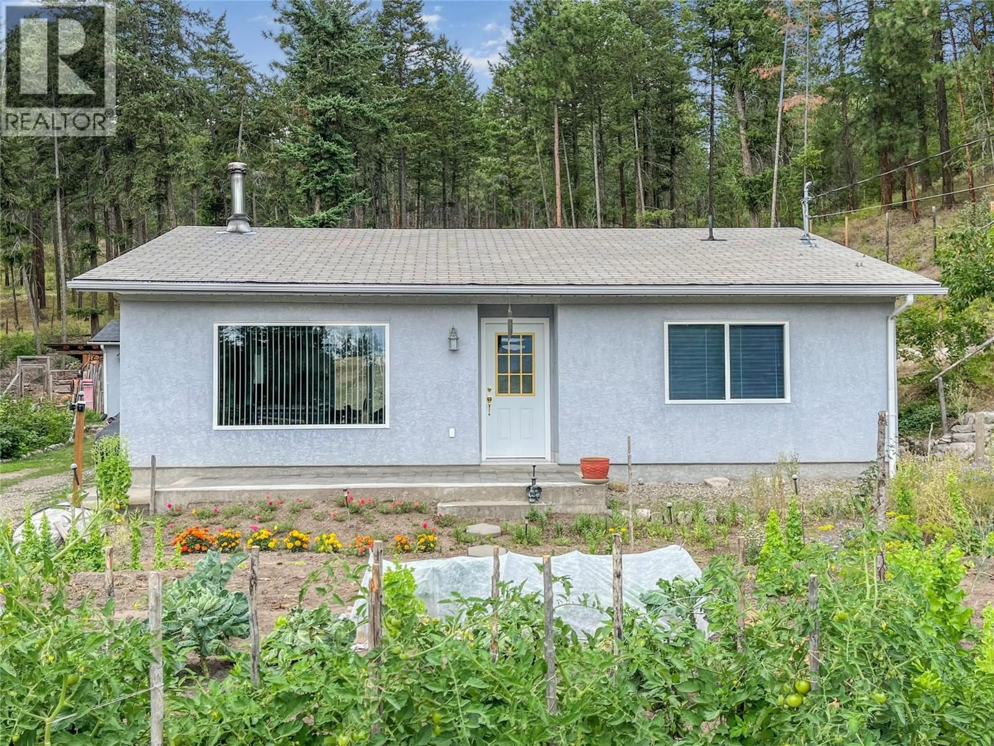 Home with vinyl exterior material, unknown for 7410 SHALAL ROAD, Kelowna British Columbia V1Z3W7