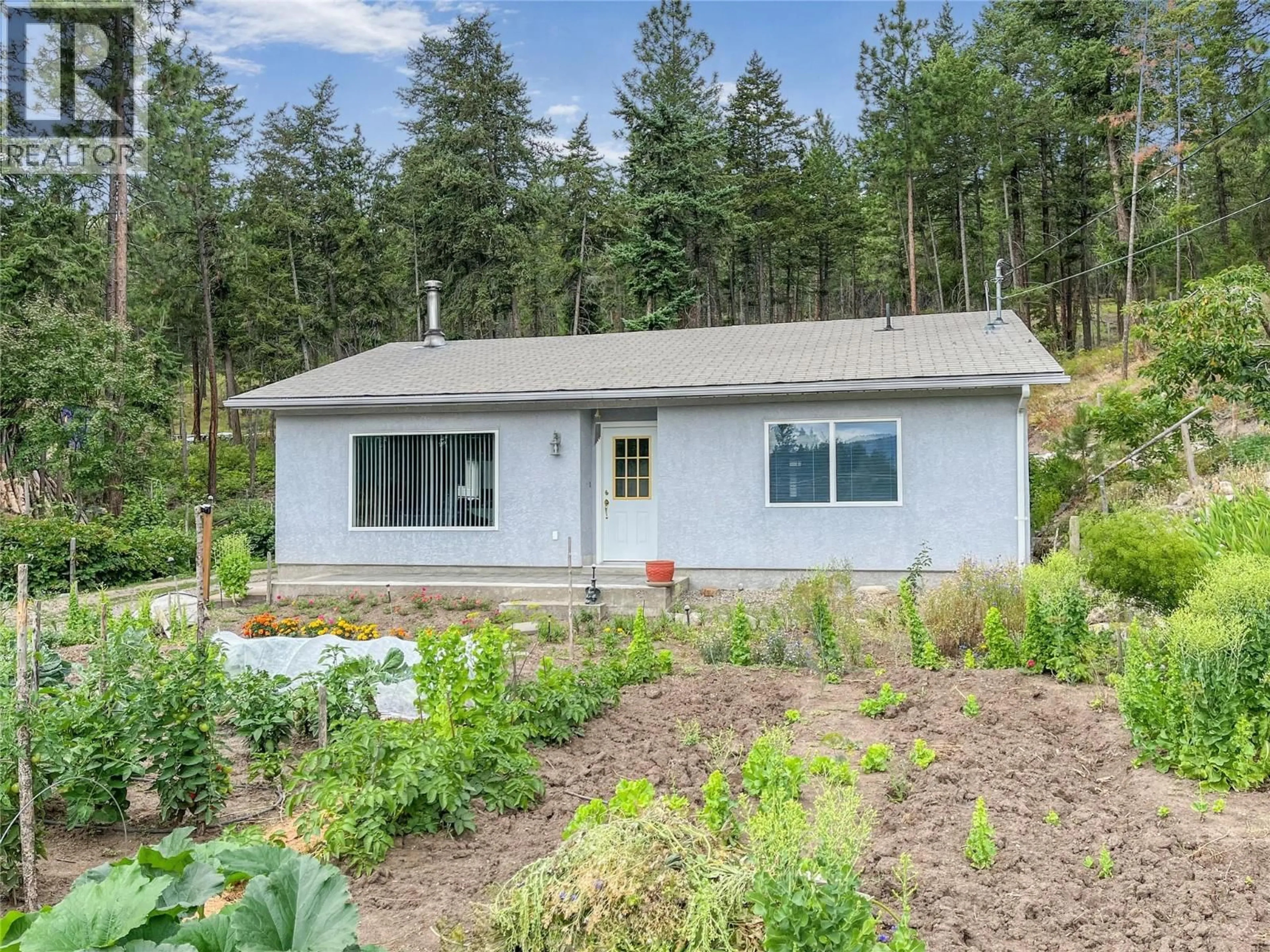 Home with vinyl exterior material, unknown for 7410 SHALAL ROAD, Kelowna British Columbia V1Z3W7