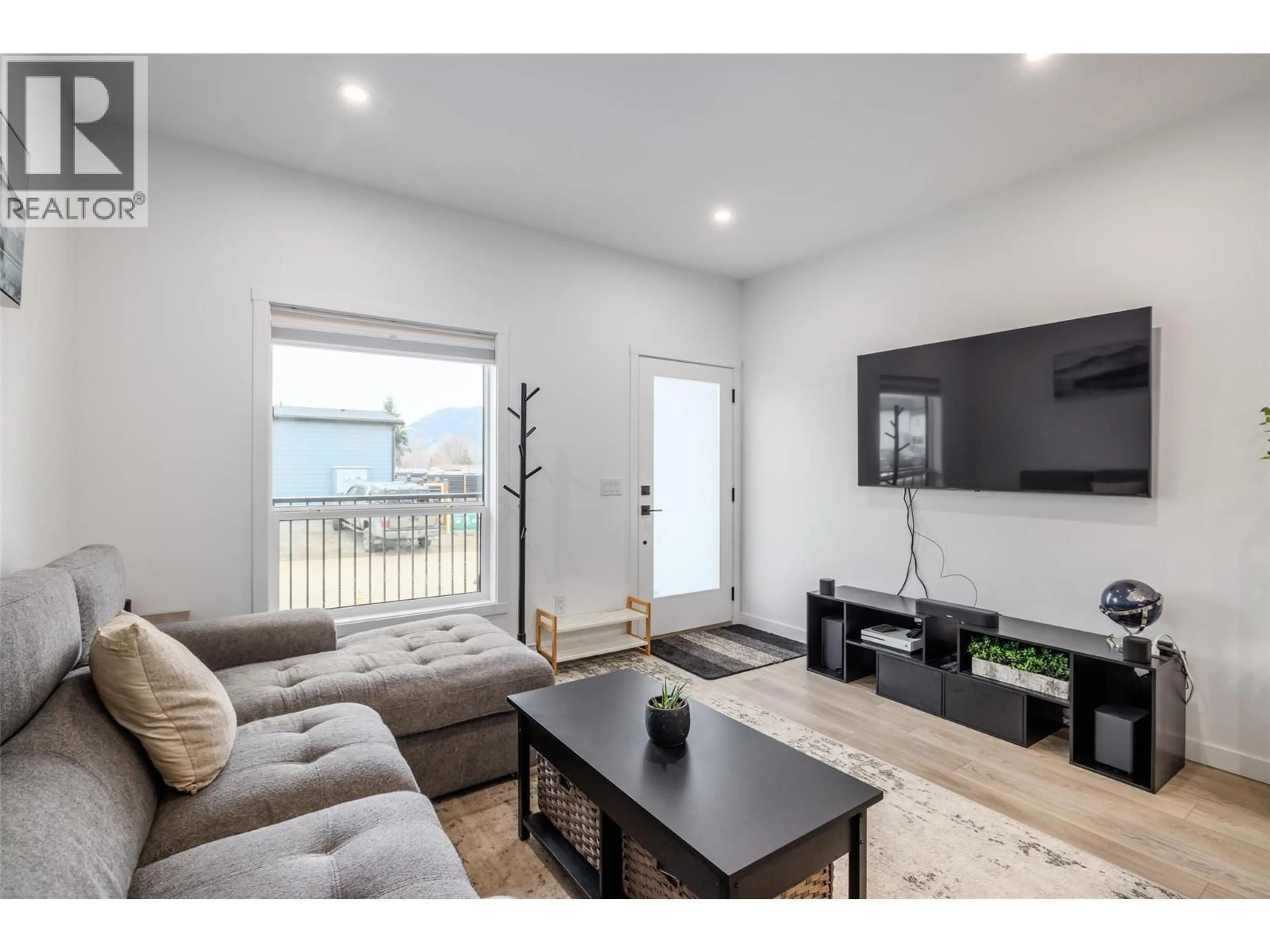 Living room with furniture, wood/laminate floor for 183 - 8900 JIM BAILEY ROAD, Kelowna British Columbia V4V0B5