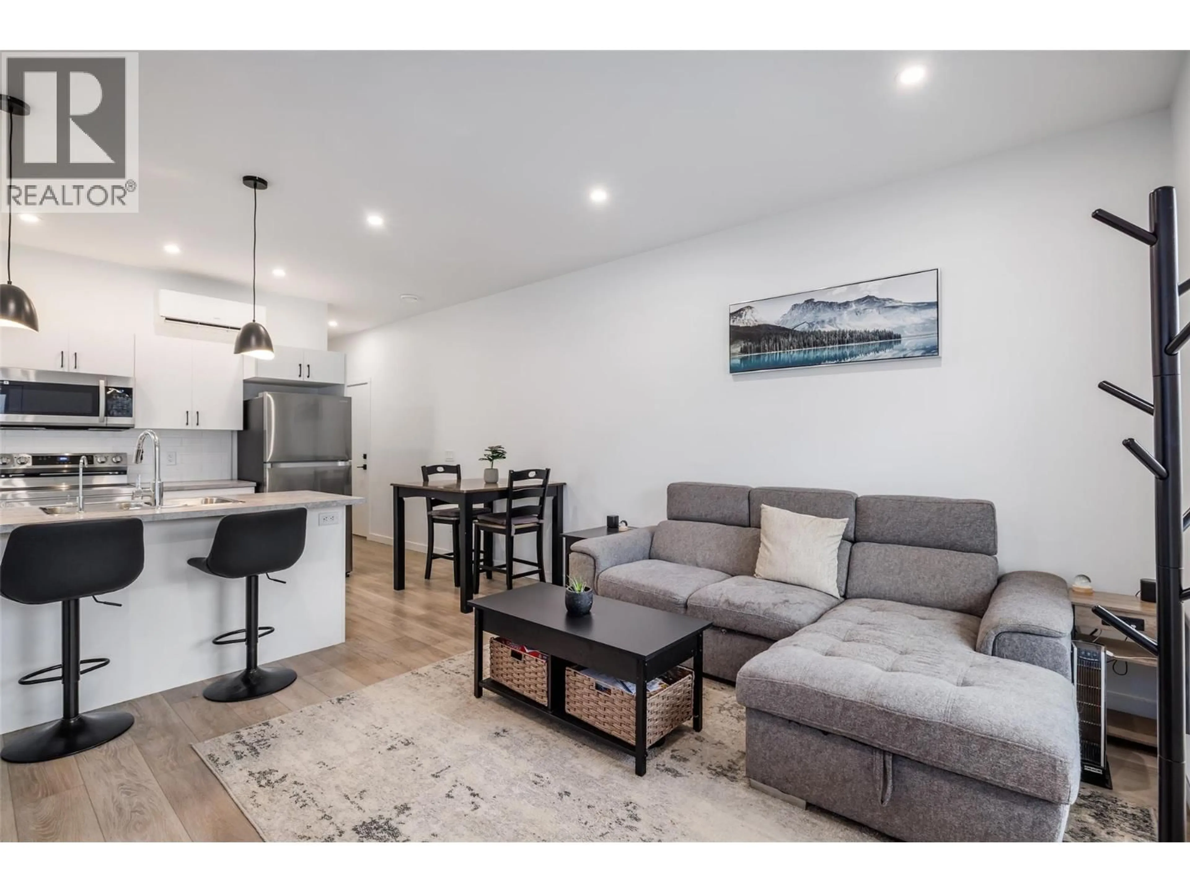 Living room with furniture, wood/laminate floor for 183 - 8900 JIM BAILEY ROAD, Kelowna British Columbia V4V0B5