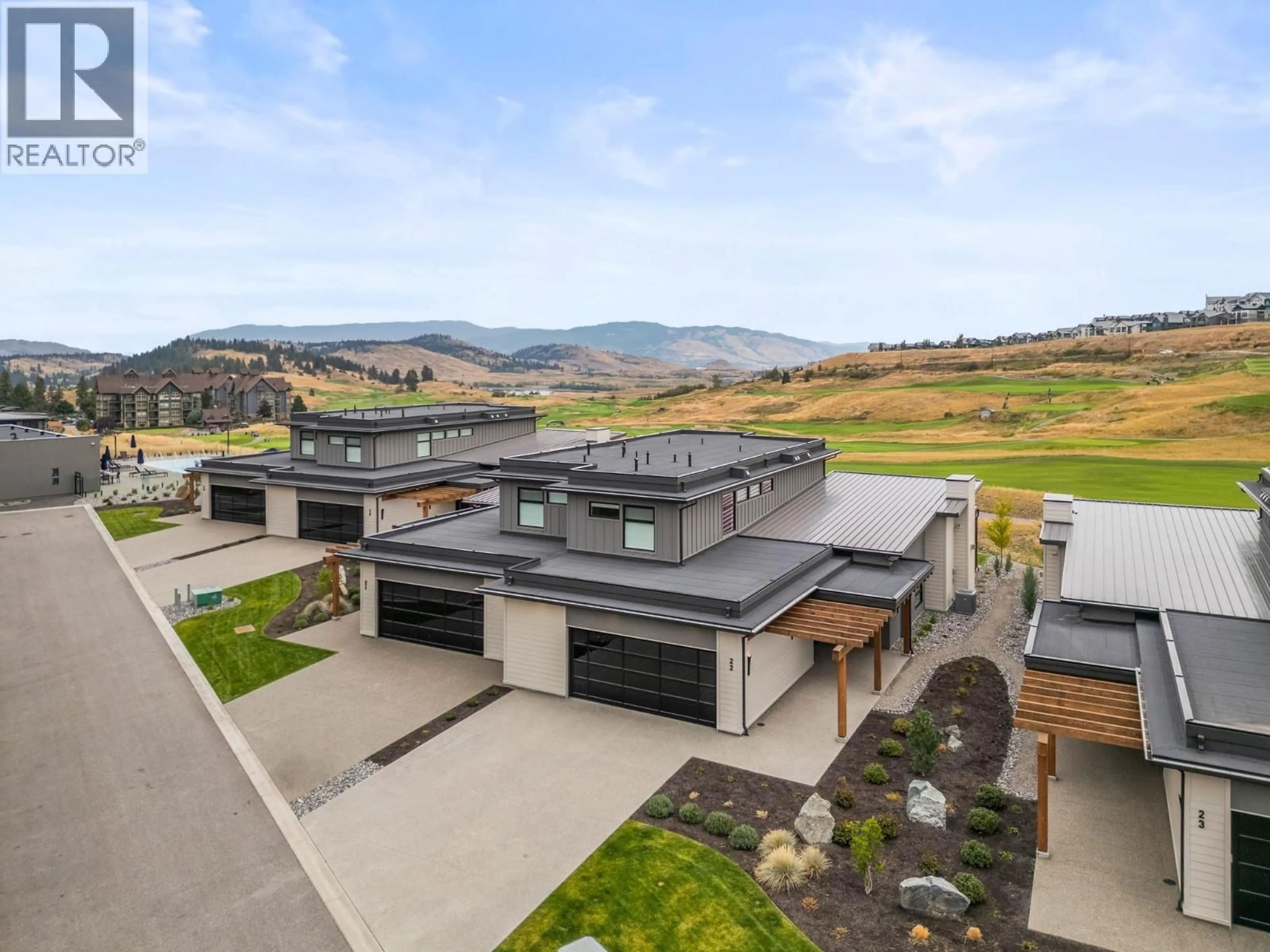 A pic from outside/outdoor area/front of a property/back of a property/a pic from drone, mountain view for 22 - 105 PREDATOR RIDGE DRIVE, Vernon British Columbia V1H0A5