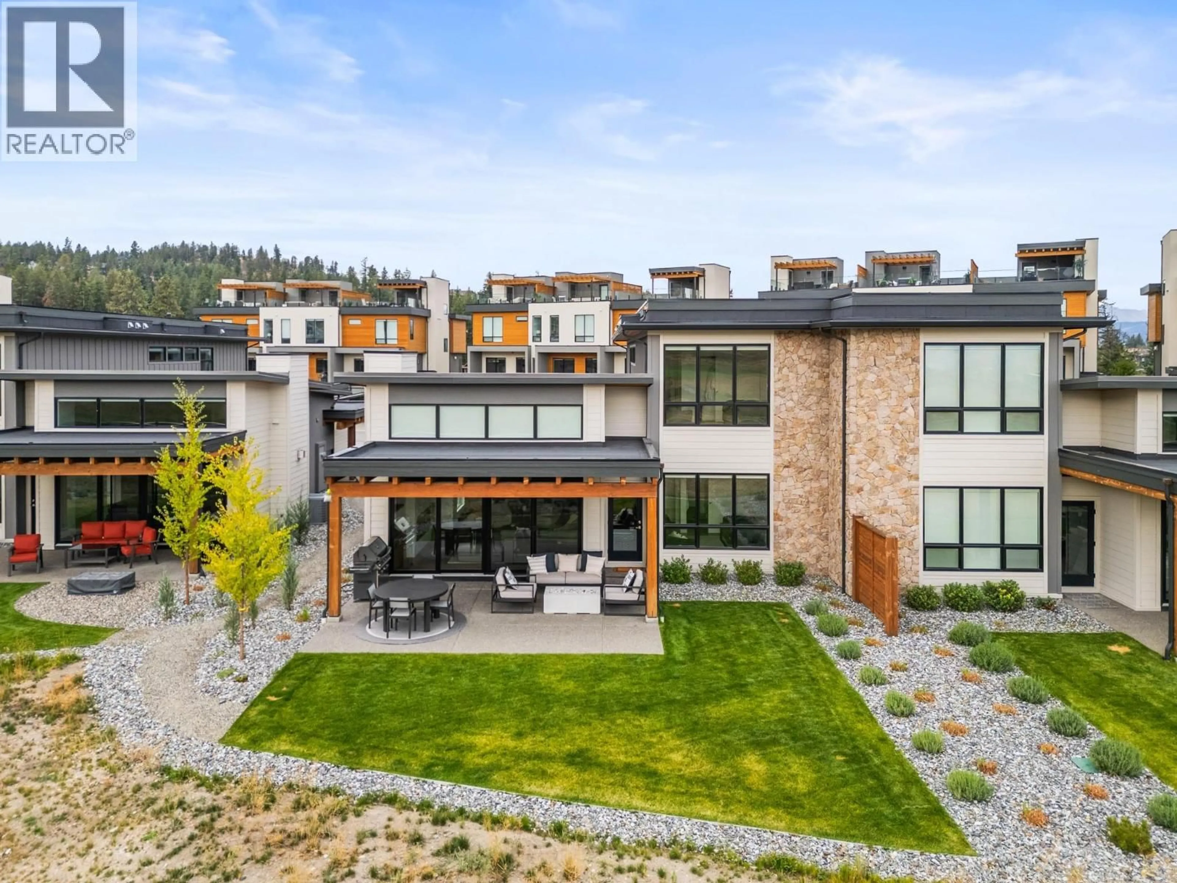 A pic from outside/outdoor area/front of a property/back of a property/a pic from drone, mountain view for 22 - 105 PREDATOR RIDGE DRIVE, Vernon British Columbia V1H0A5