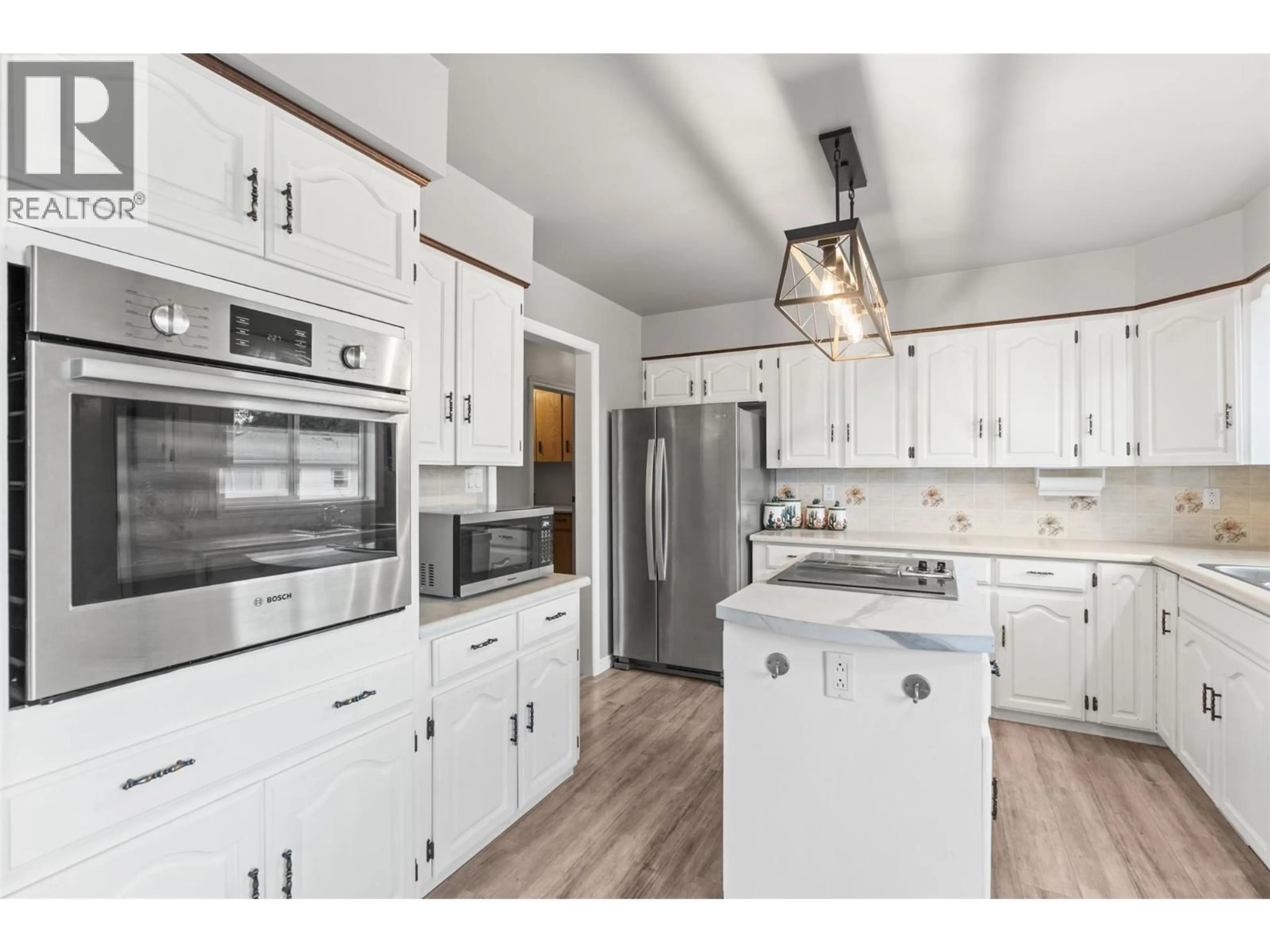 Open concept kitchen, wood/laminate floor for 721 GRANVILLE AVENUE, Enderby British Columbia V0E1V0