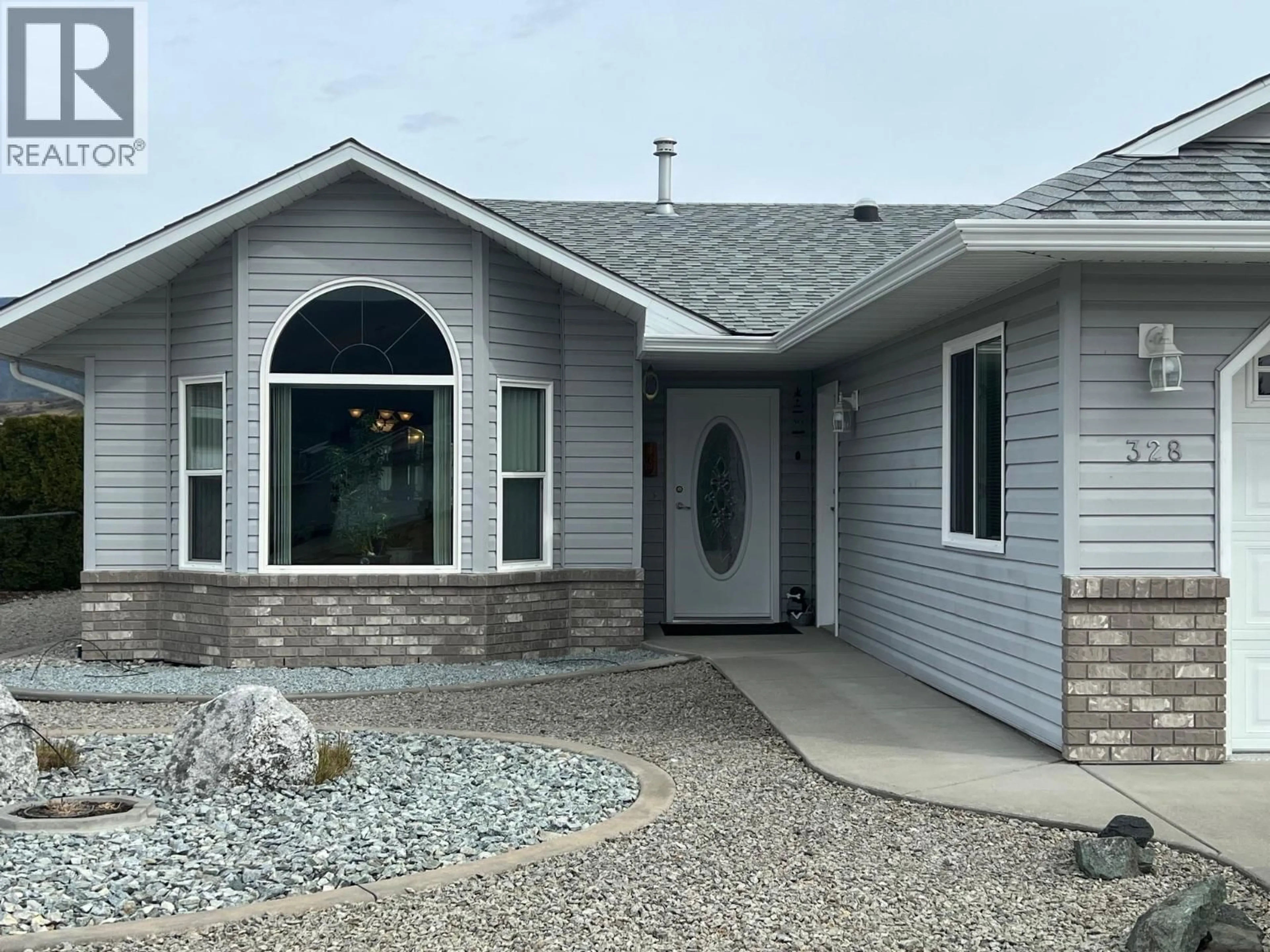 Home with vinyl exterior material, street for 328 3RD STREET, Vernon British Columbia V1H1Z1