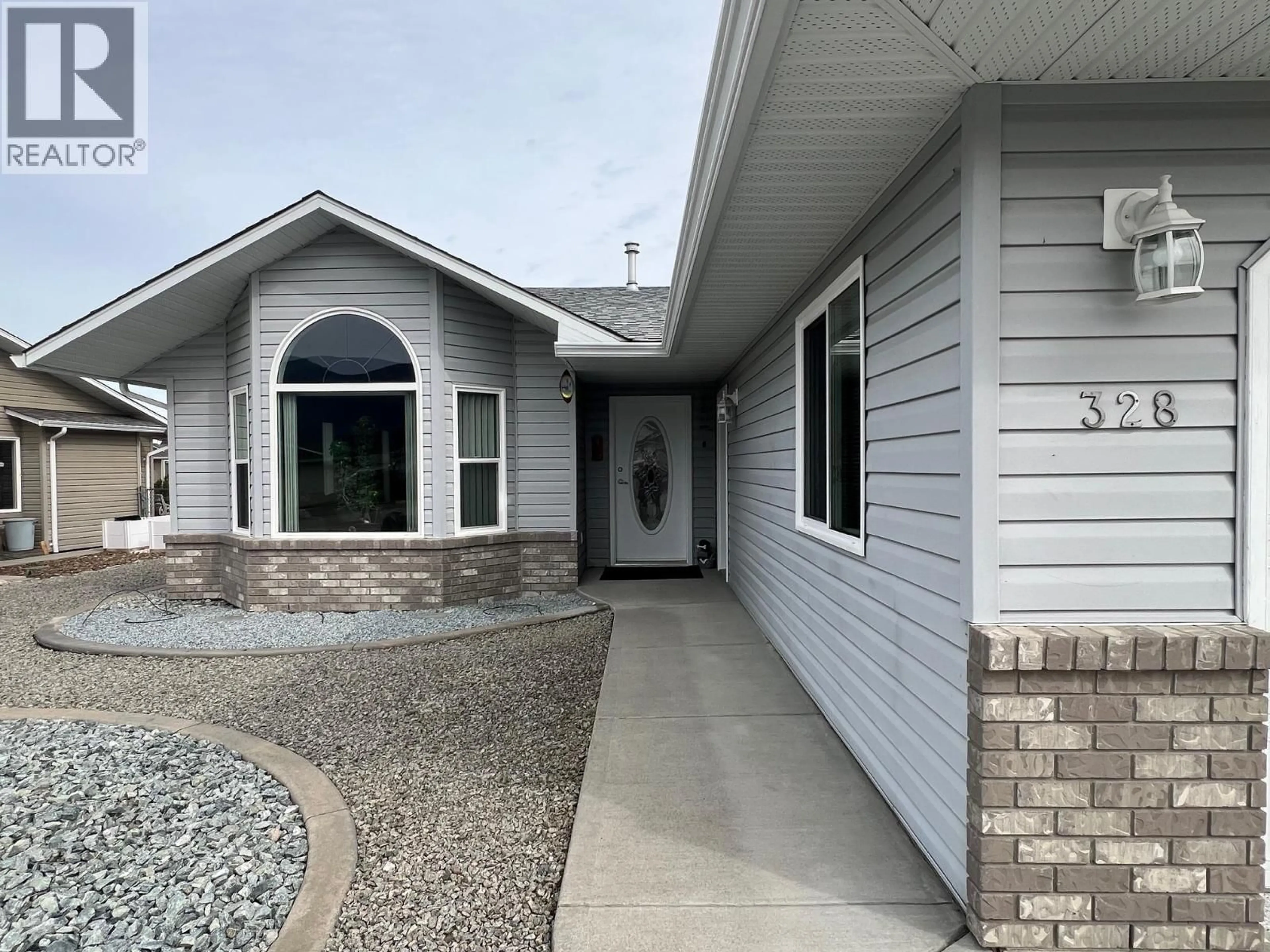 Home with vinyl exterior material, street for 328 3RD STREET, Vernon British Columbia V1H1Z1