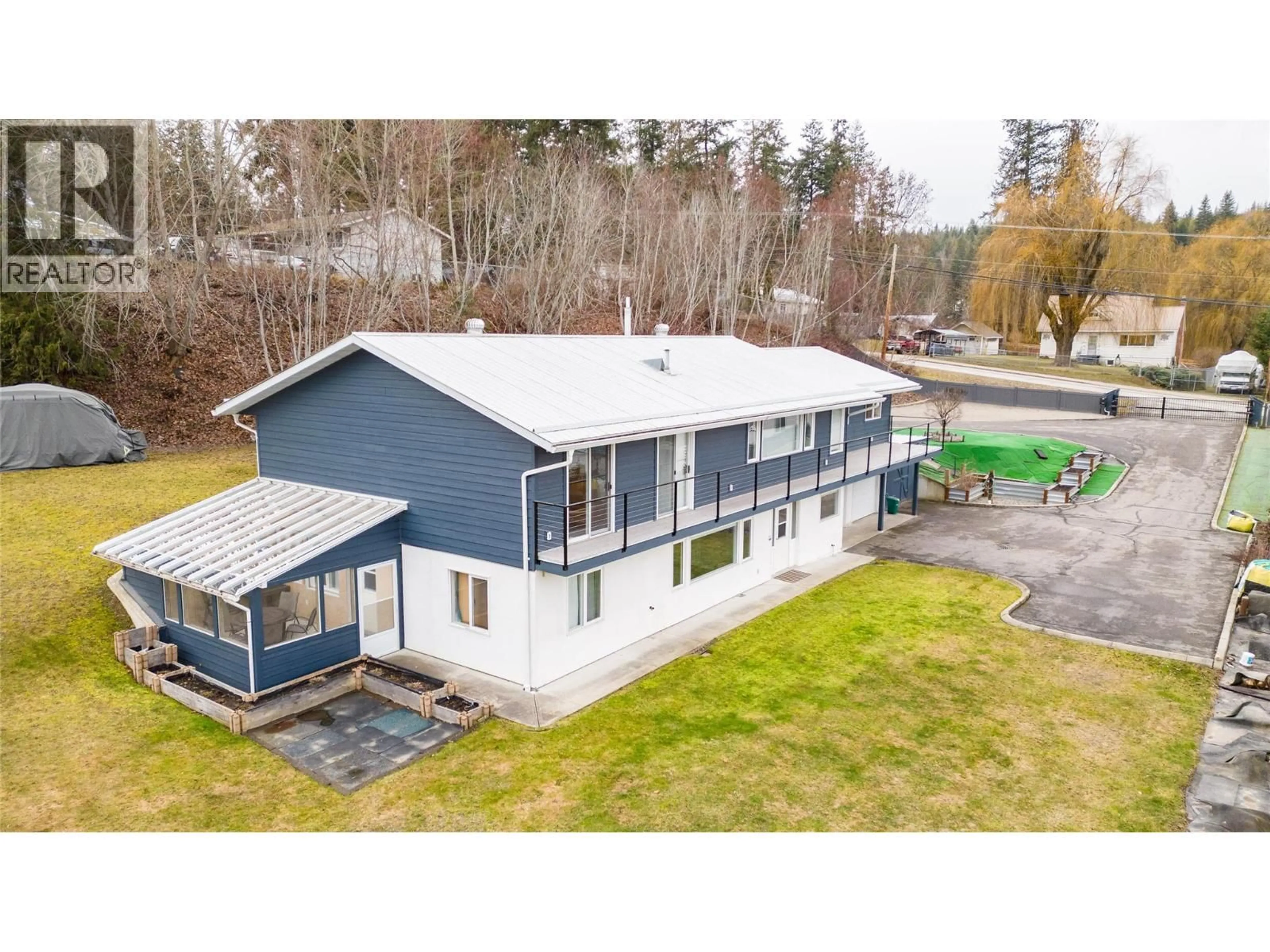 A pic from outside/outdoor area/front of a property/back of a property/a pic from drone, building for 6960 50 STREET NORTHEAST, Salmon Arm British Columbia V0E1K0