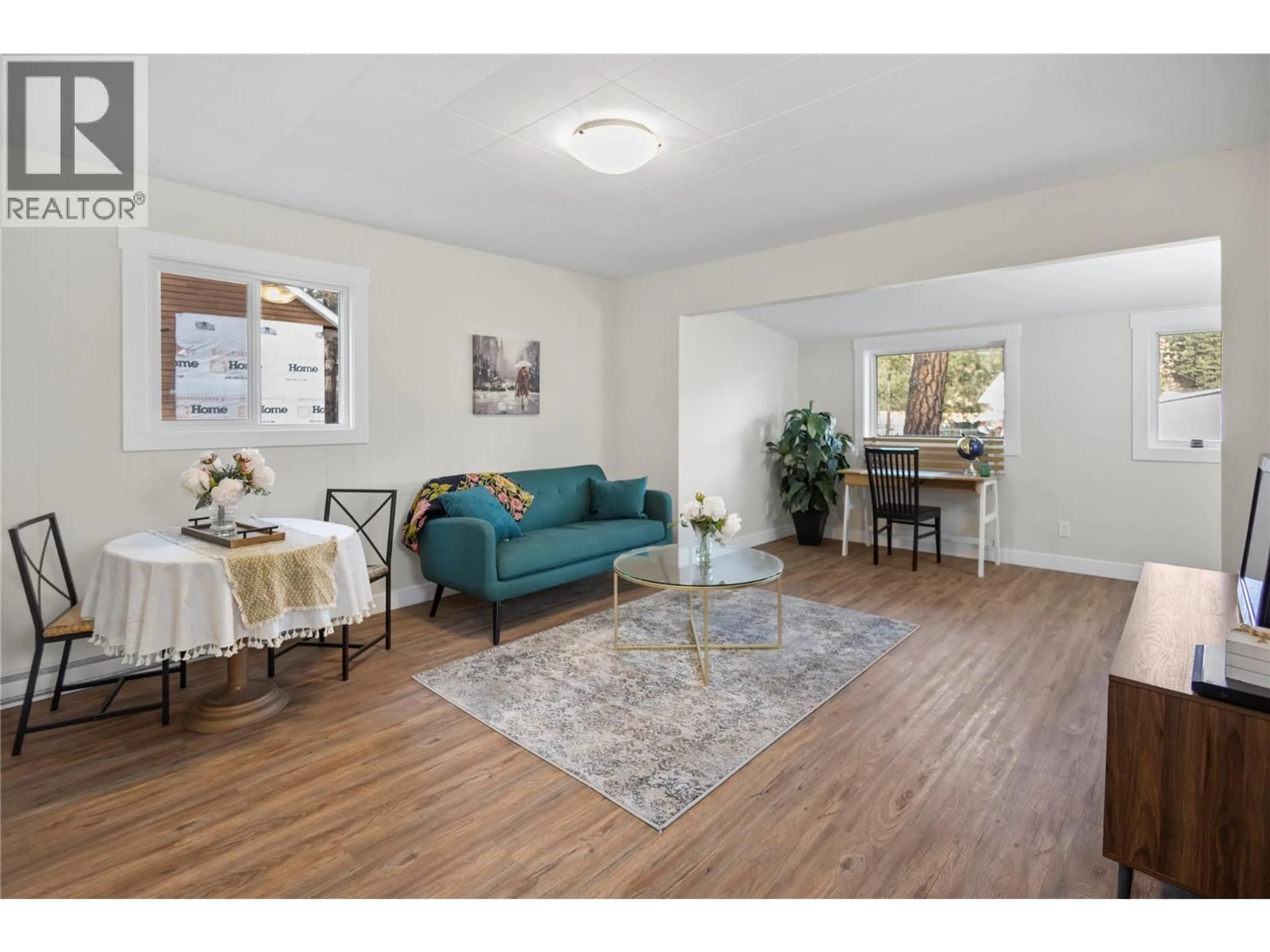 Living room with furniture, wood/laminate floor for 8127 DONALDSON DRIVE, Grand Forks British Columbia V0H1H2