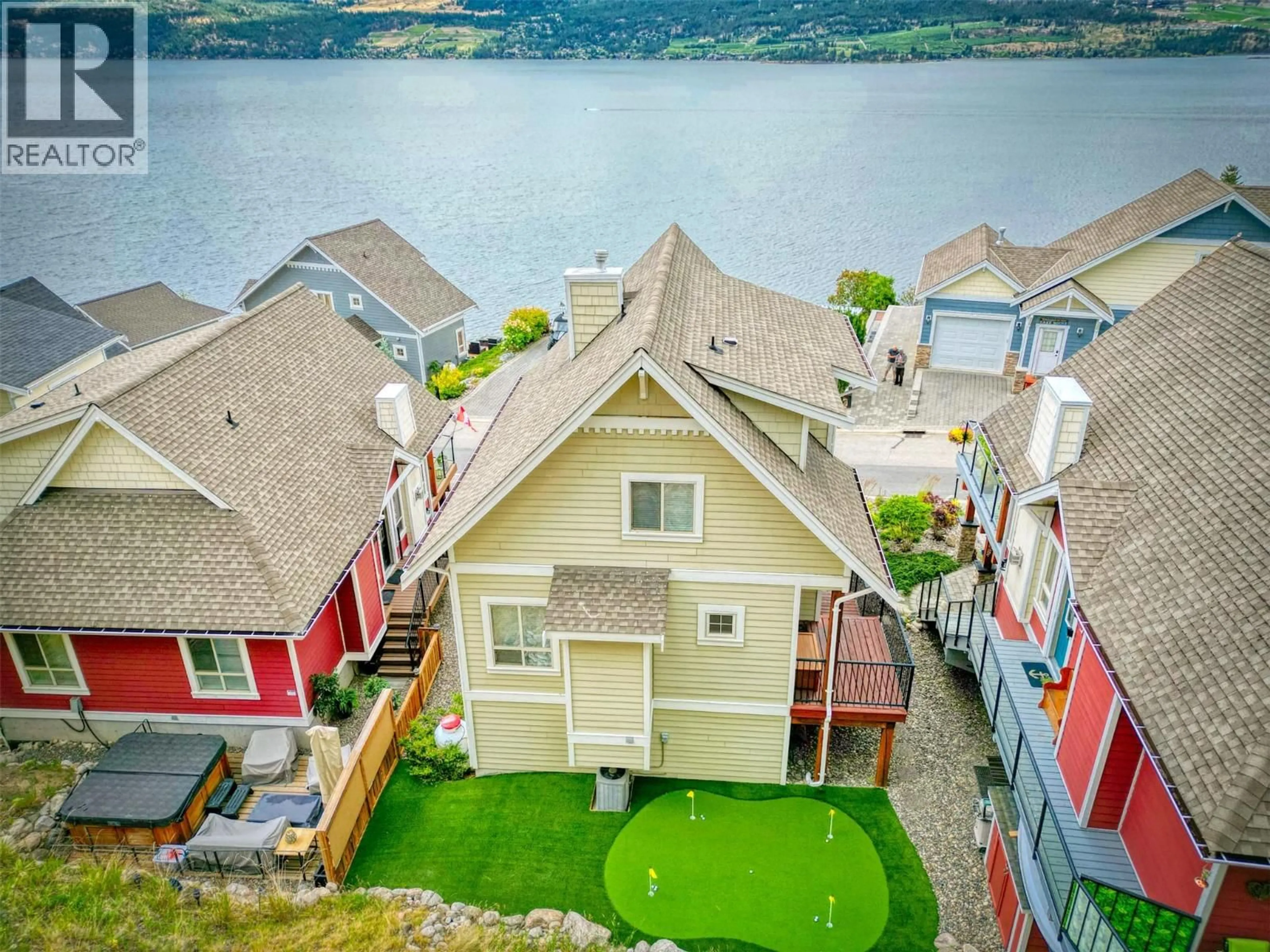 A pic from outside/outdoor area/front of a property/back of a property/a pic from drone, water/lake/river/ocean view for 52 - 6920 BARCELONA DRIVE, Kelowna British Columbia V1Z3R8
